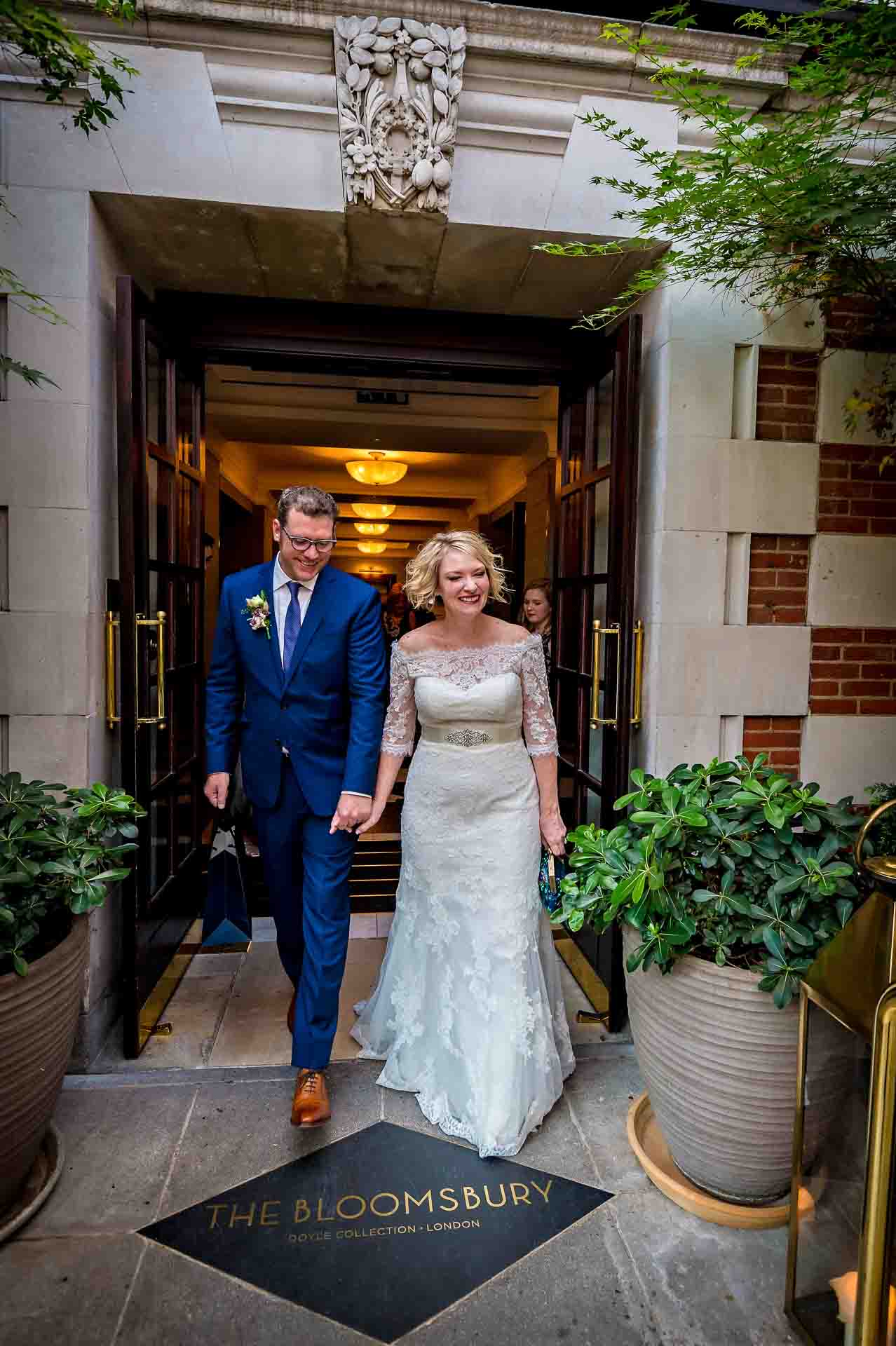 Newly-weds exiting through the front door of the Bloomsbury Hotel, London