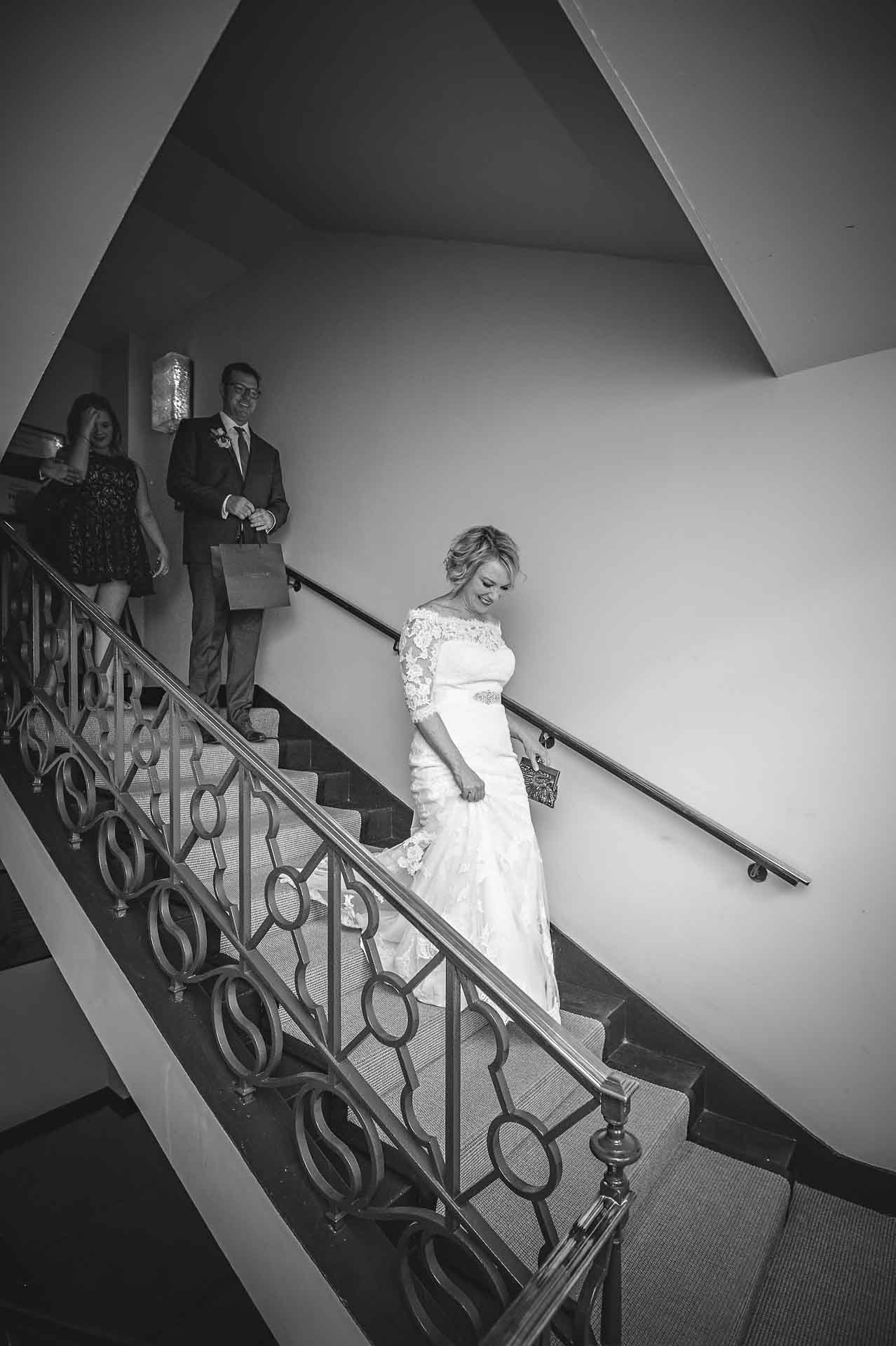 Bride Walking Downstairs after Wedding in Hotel