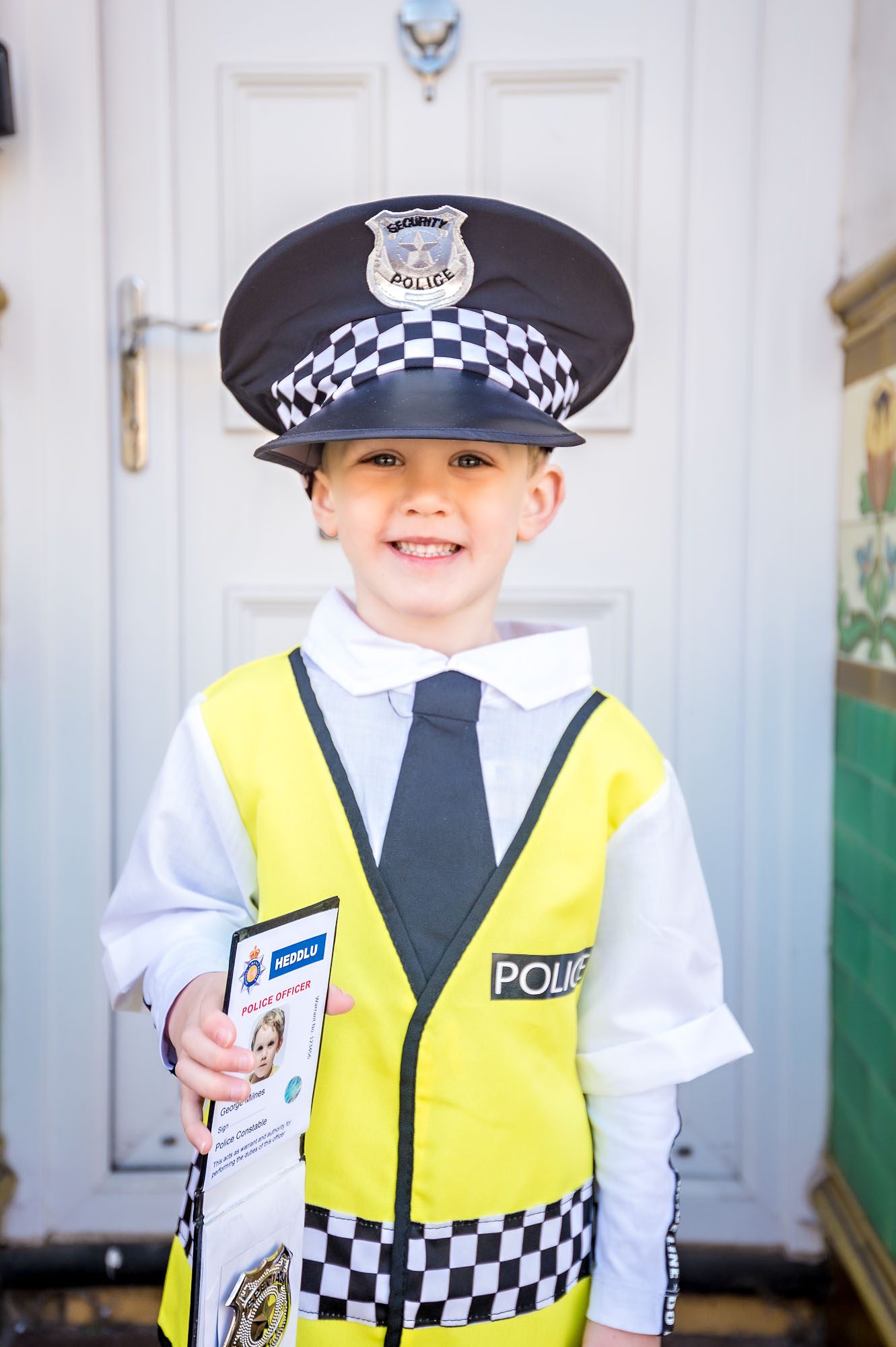 Little boy dressed as policeman