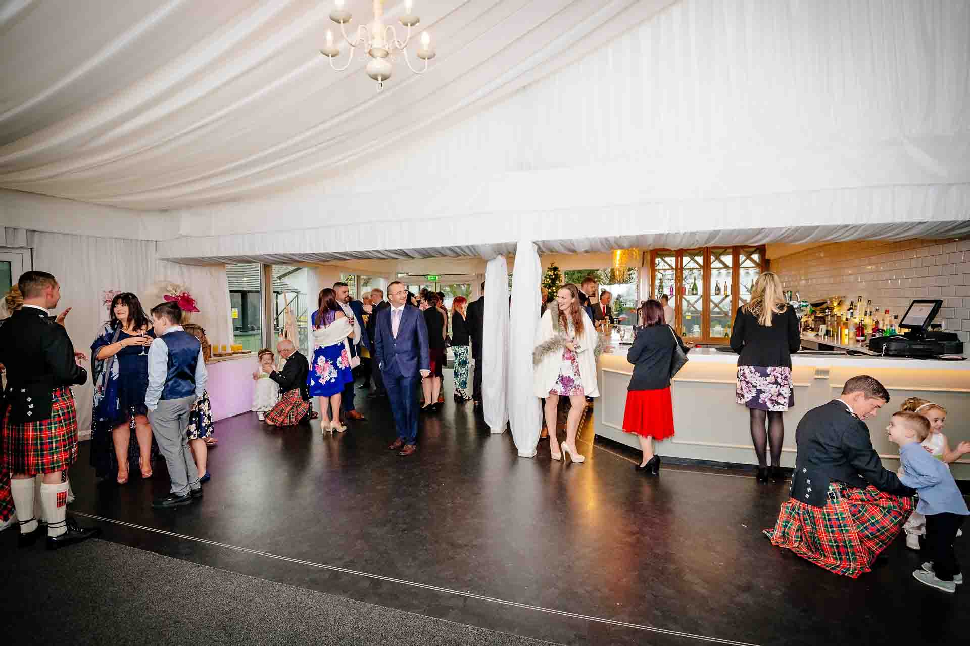 Wide shot of bar area in Garden Marquee at Llechwen Hall Hotel wedding