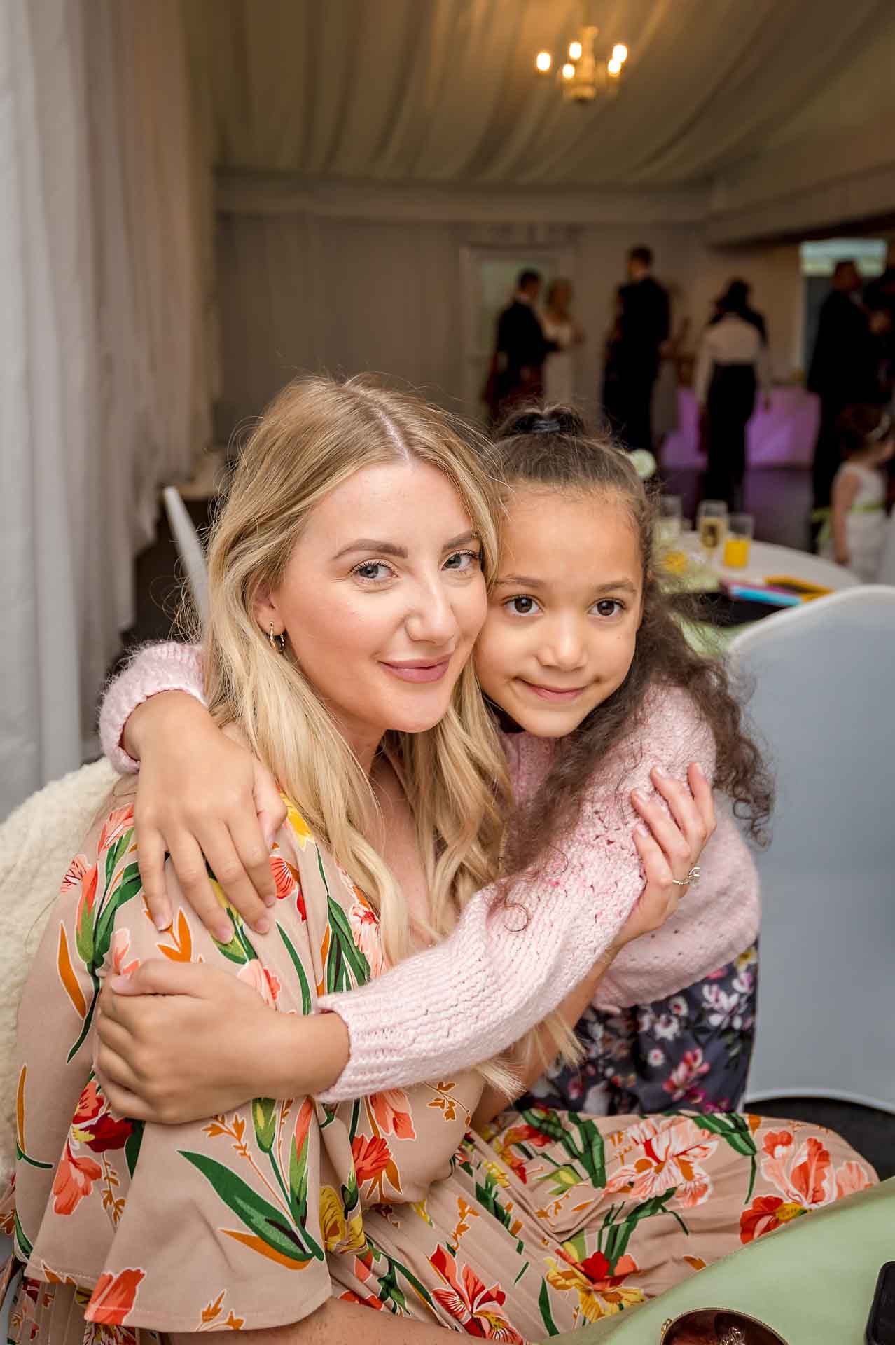 Mother and daughter at v wedding reception