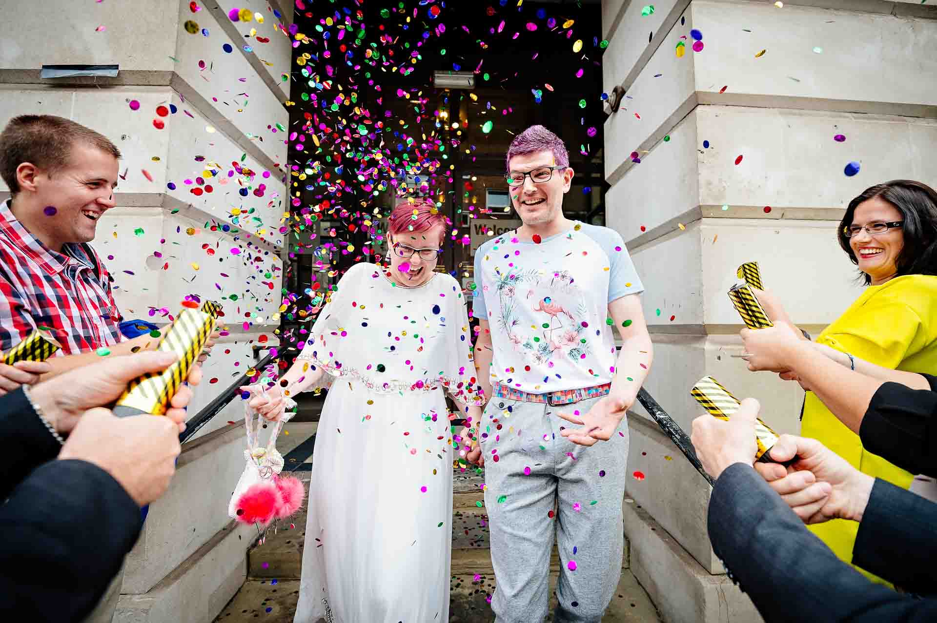 Camden Town Hall Wedding Photographer - Alternative Wedding Couple Exiting in Confetti Shower