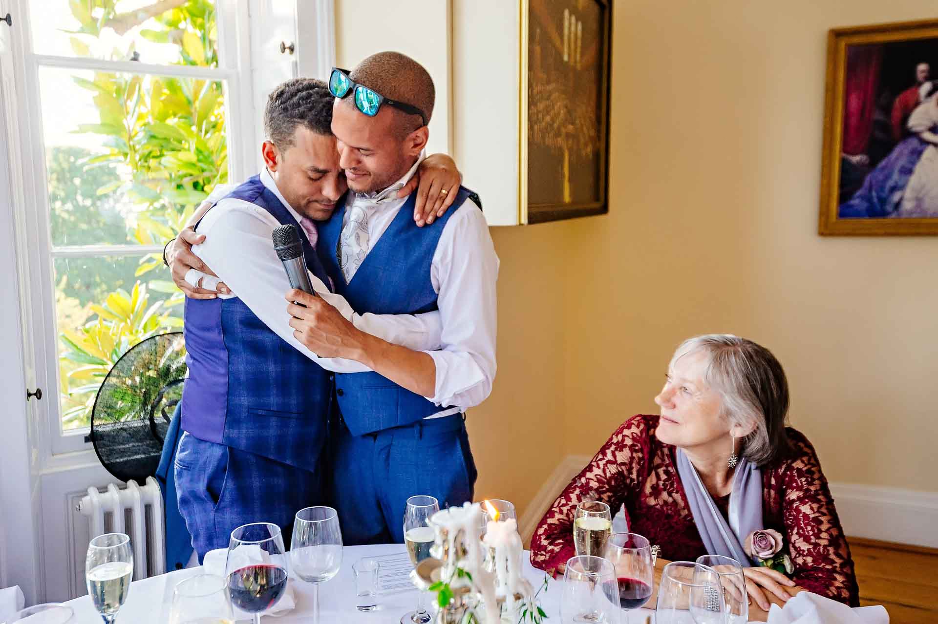 Groom and Best Man Hugging at Pembroke Lodge Wedding