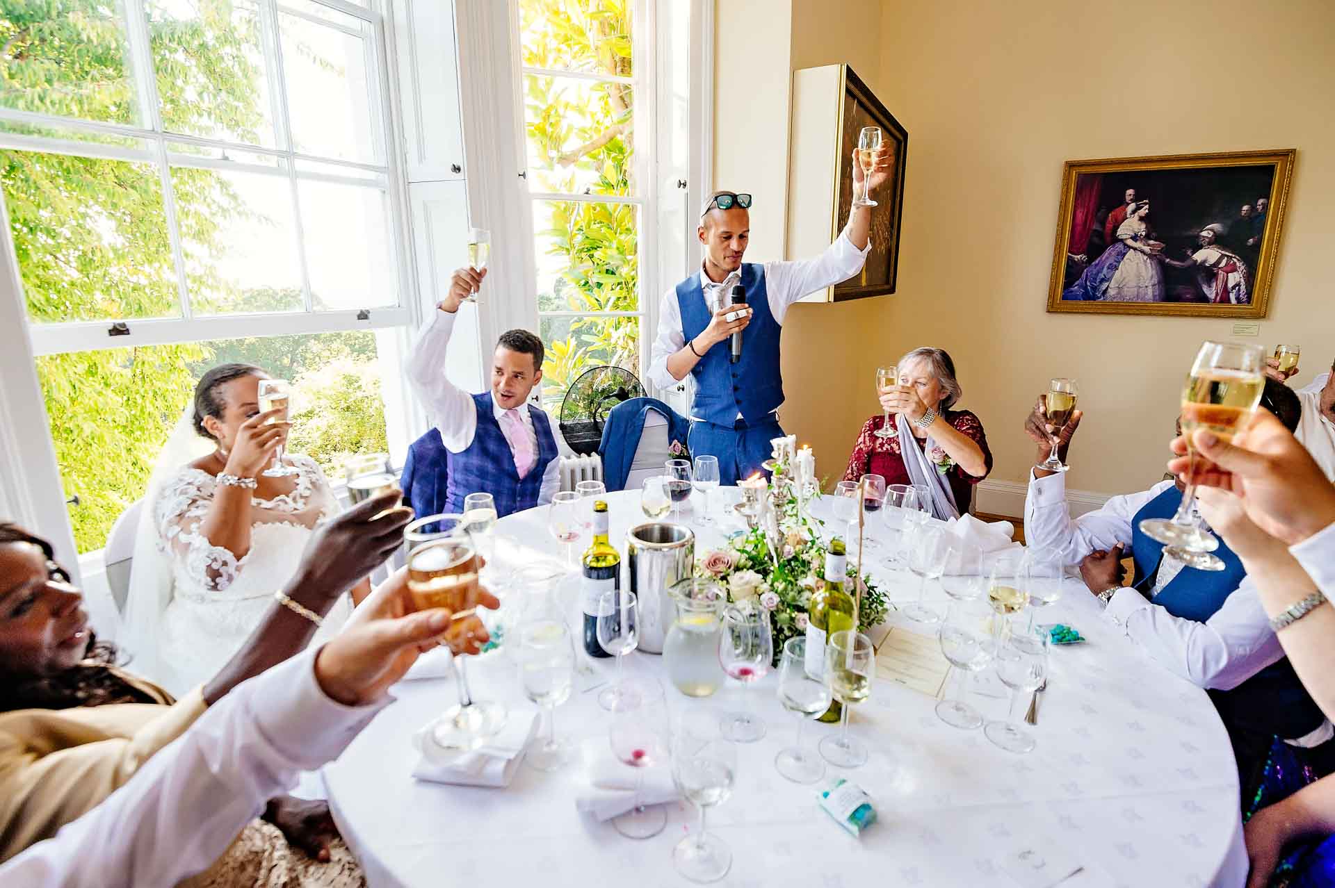 Guests Toasting Bride and Groom at Wedding Breakfast Speeches
