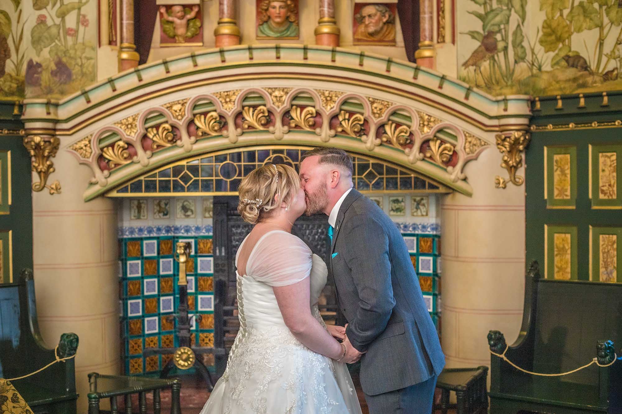 The newly-weds have their first kiss in Castell Coch's Drawing Room