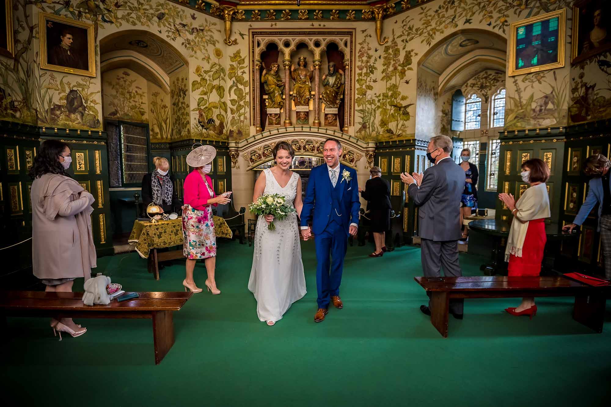 The newly-weds leaving their wedding ceremony at Castell Coch