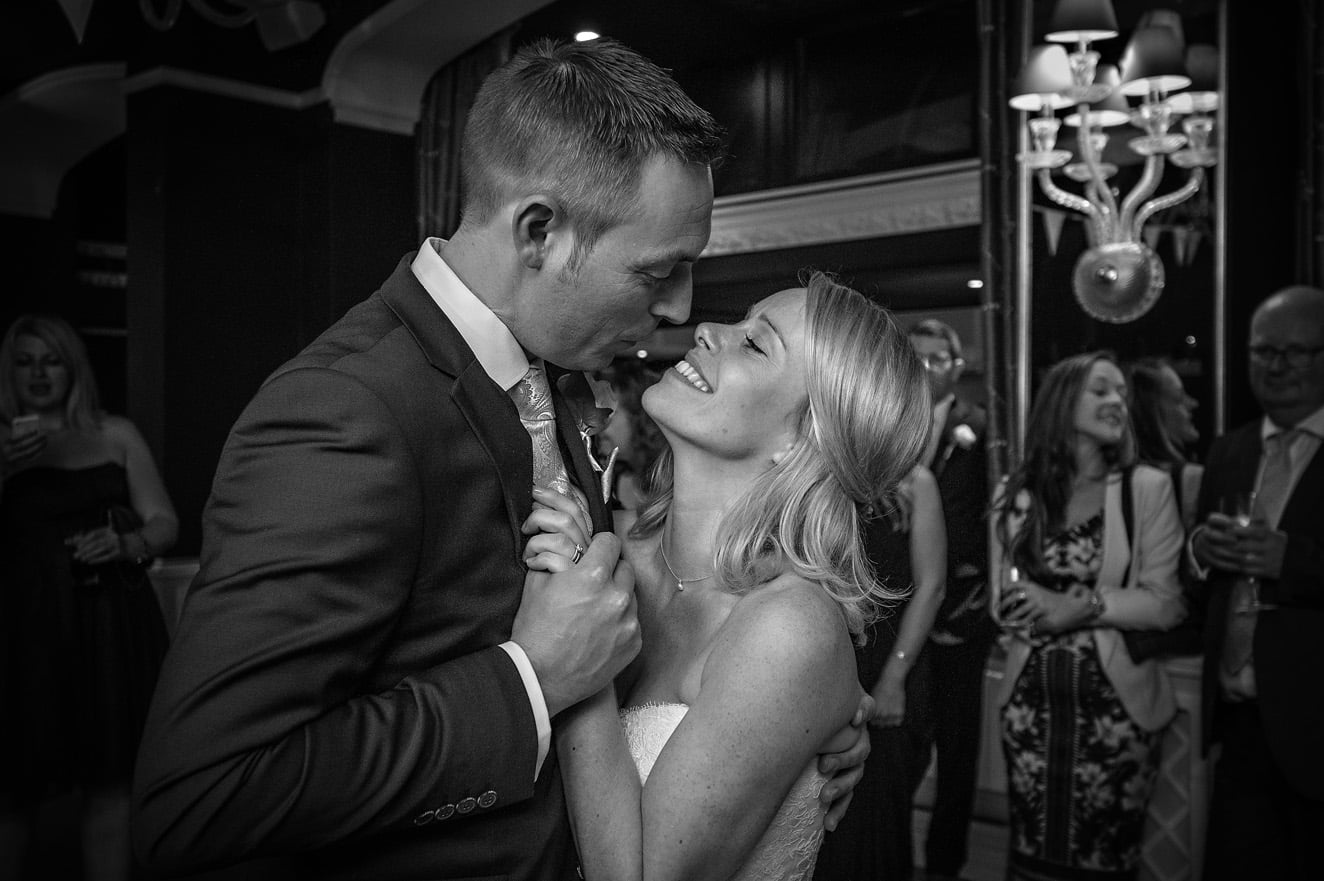Bride and groom embracing during first dance at Cardiff wedding