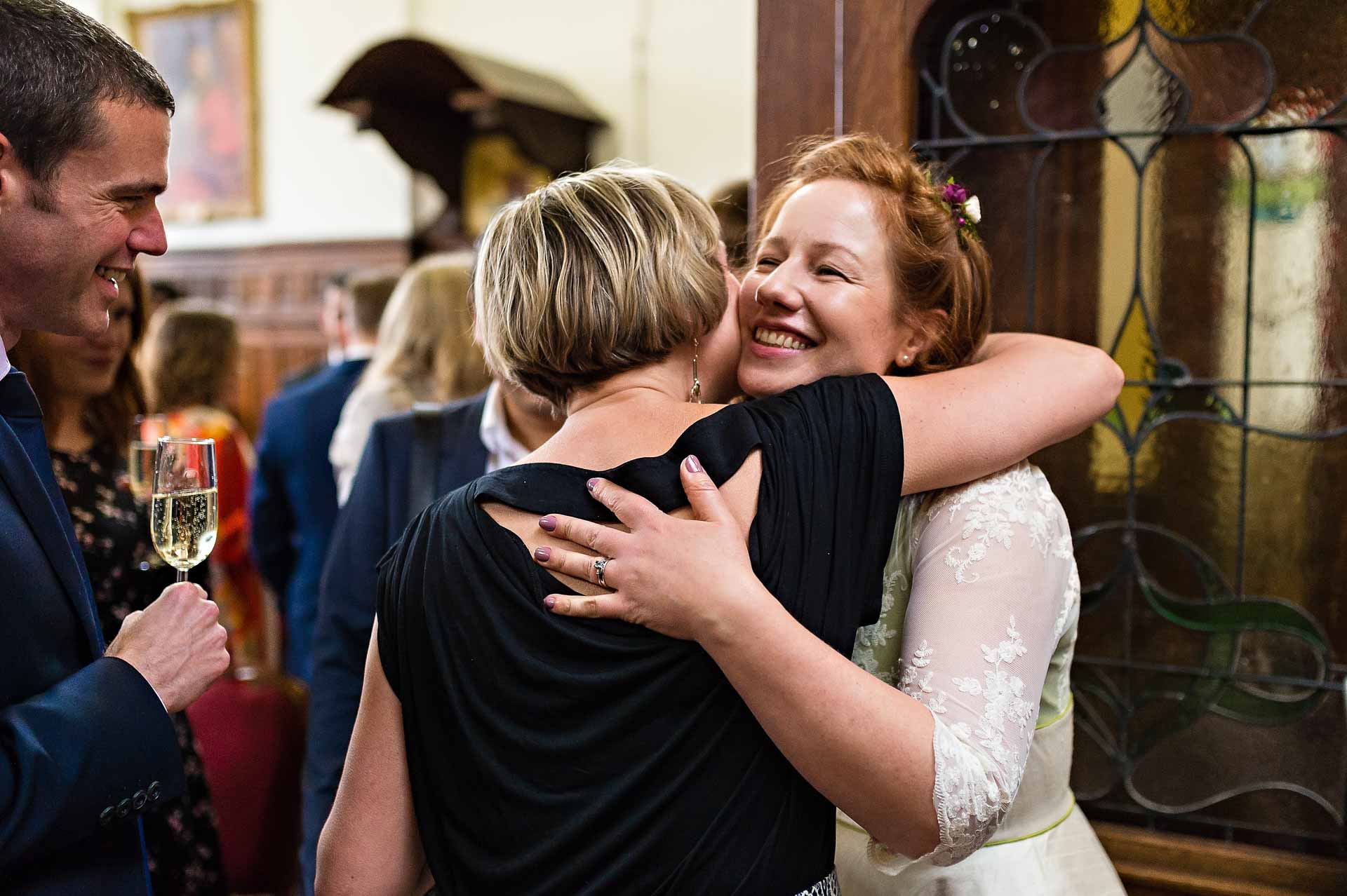 Guests Hugs Bride at Wedding