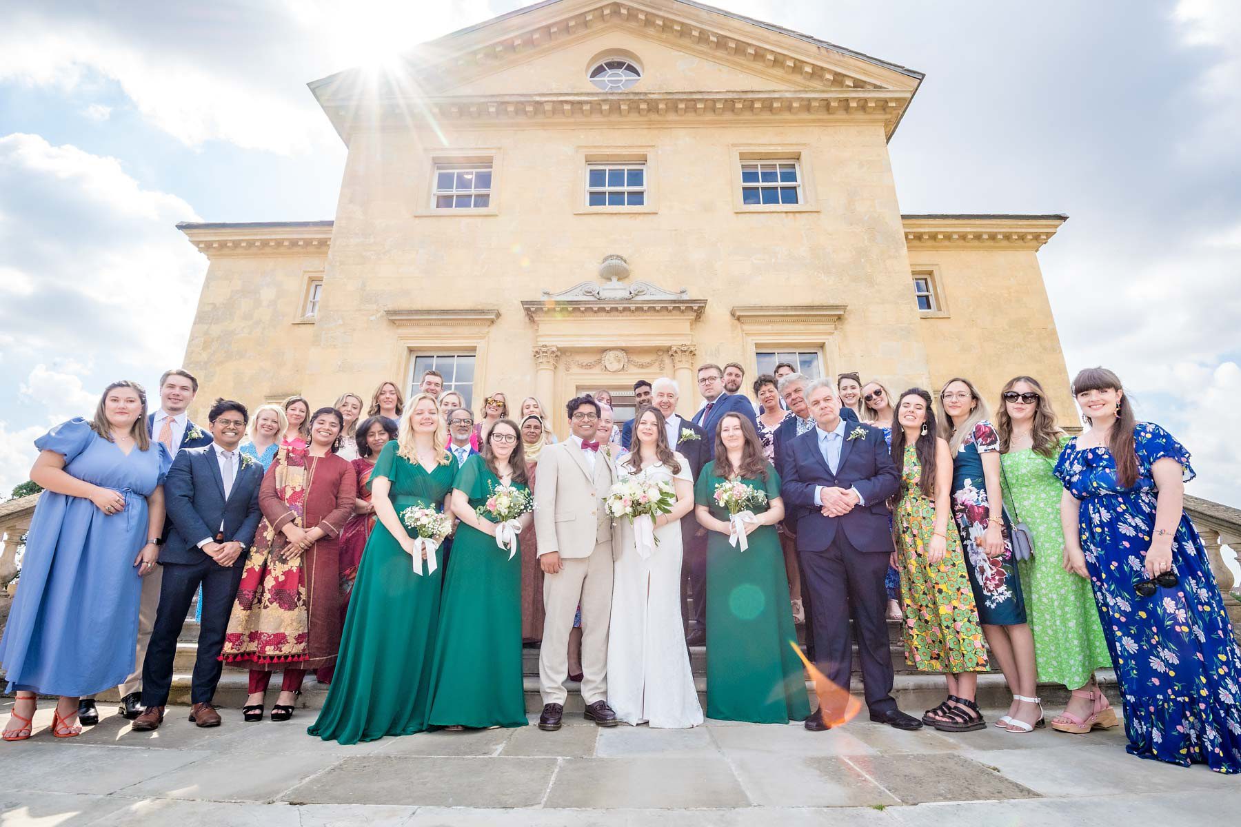 A whole party wedding photograph taken outside the front of Danson House