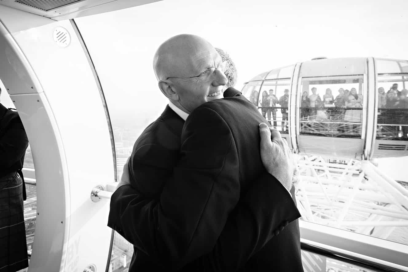 Gay Couple Hugging at London Eye Wedding