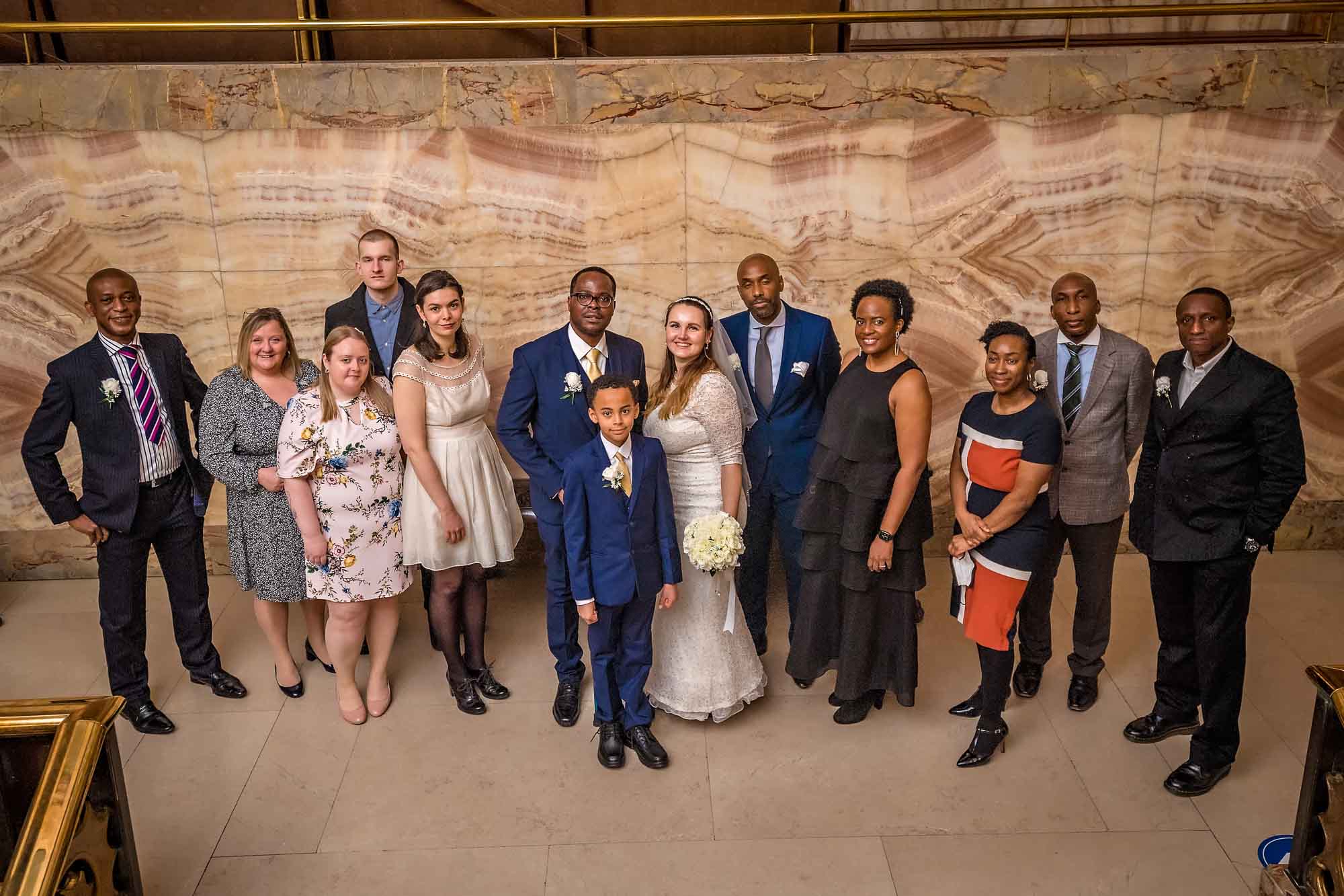 All guests pose at top of the marbled staircase at Wandsworth Town Hall