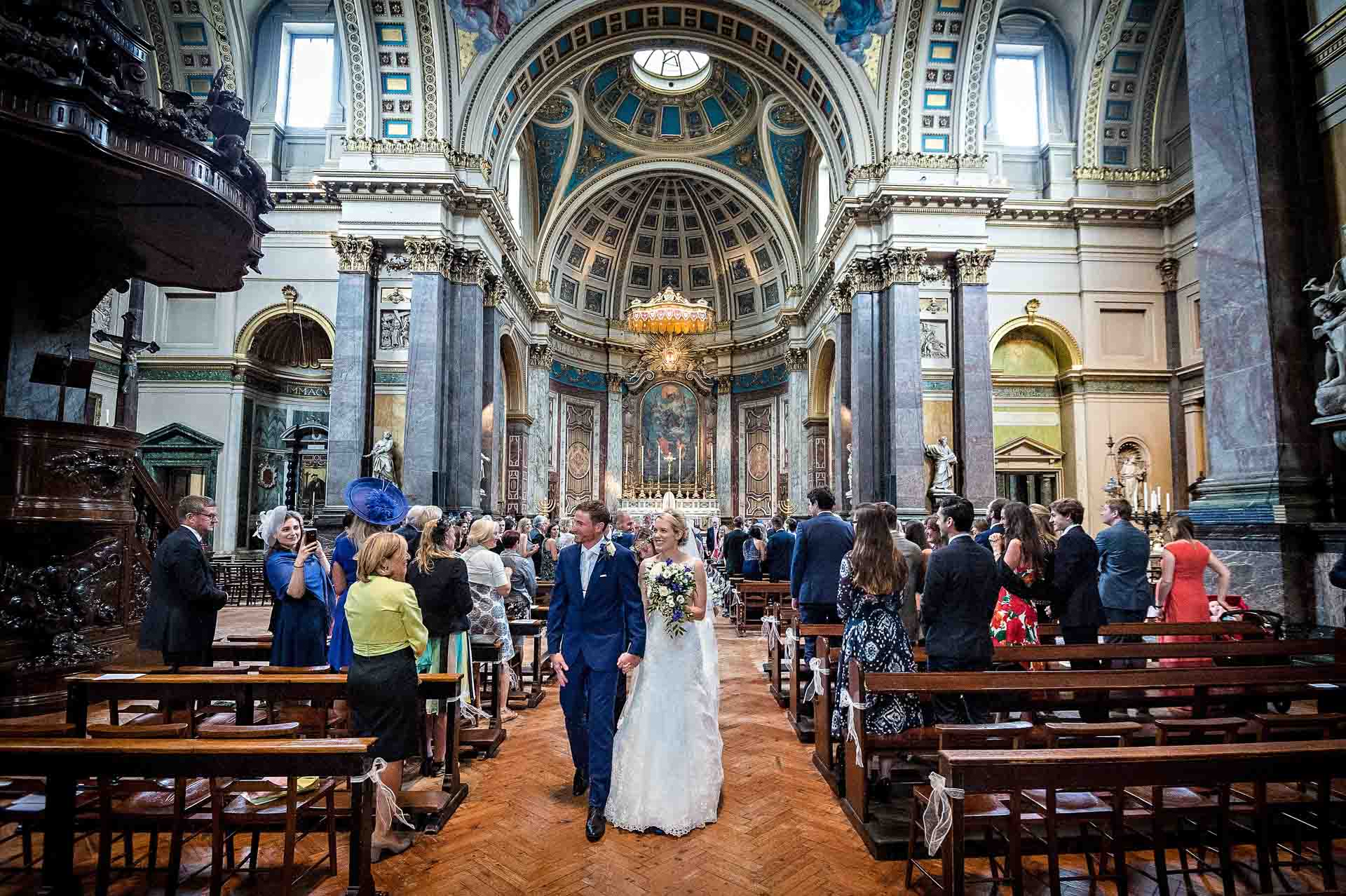 Bride and Groom Walk Down the Aisle at the Brompton Oratory