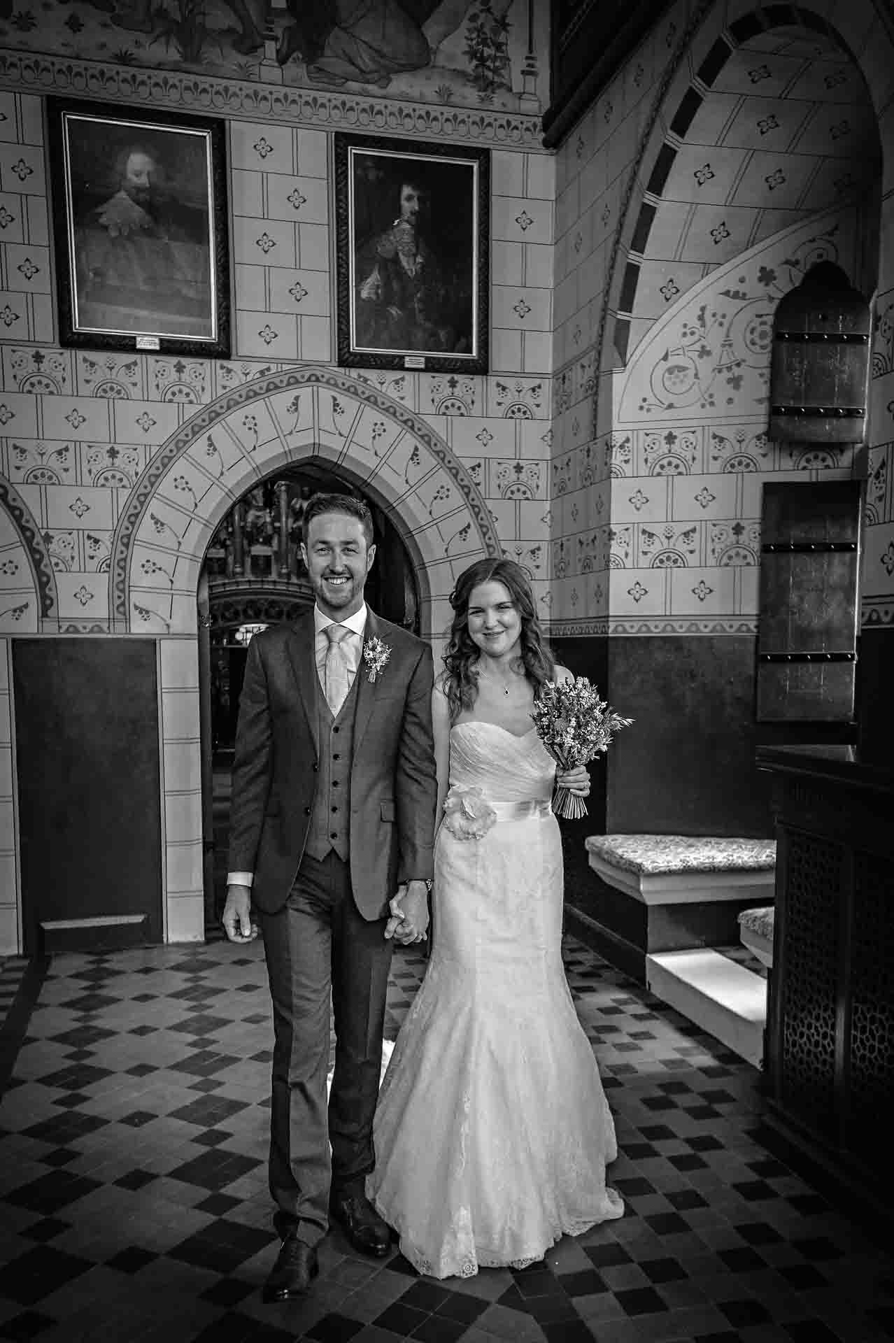 The bride and groom pass through the Banqueting Hall after their wedding ceremony