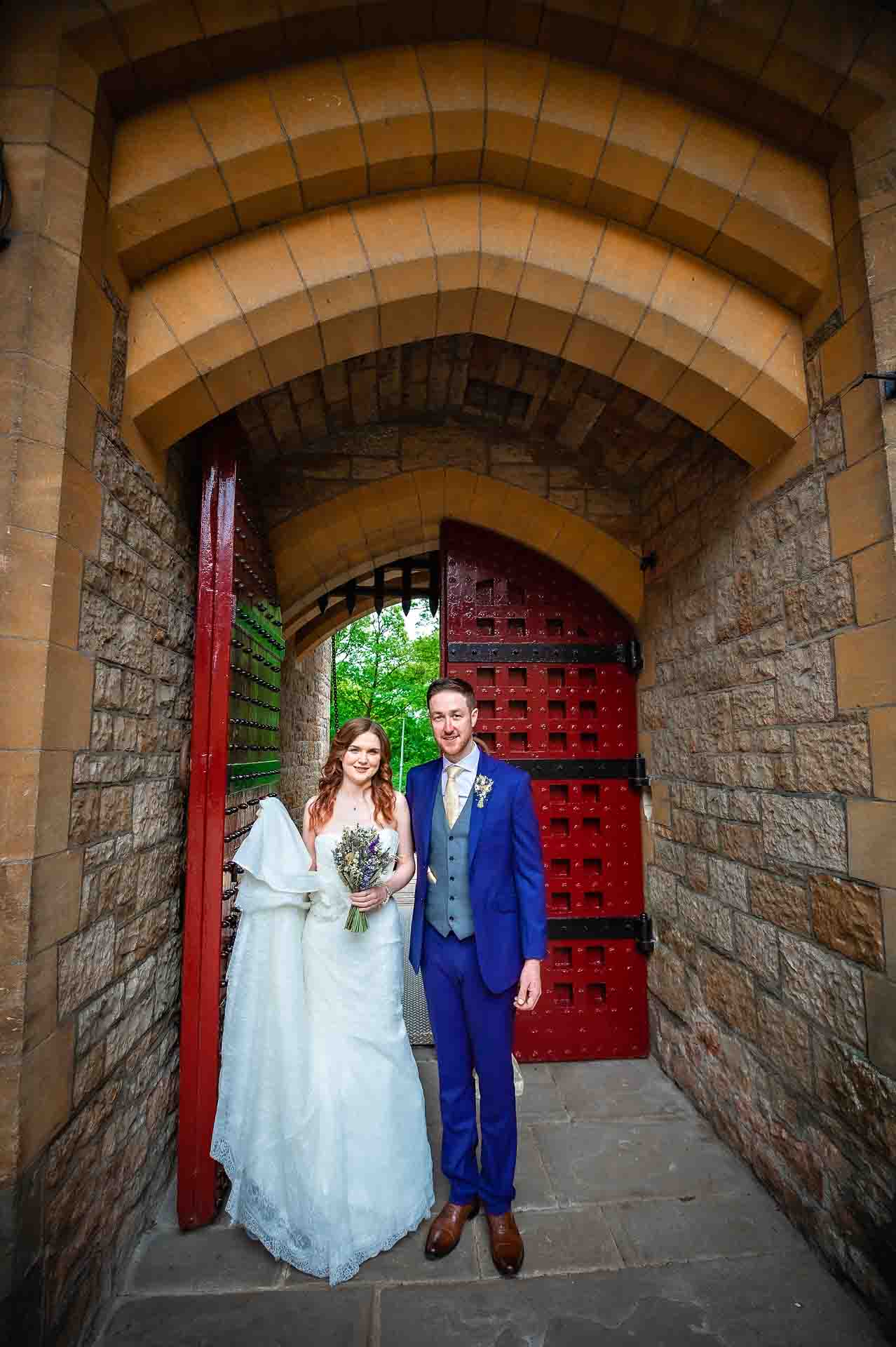 Castell Coch Couple Standing in Entrance with Portcullis