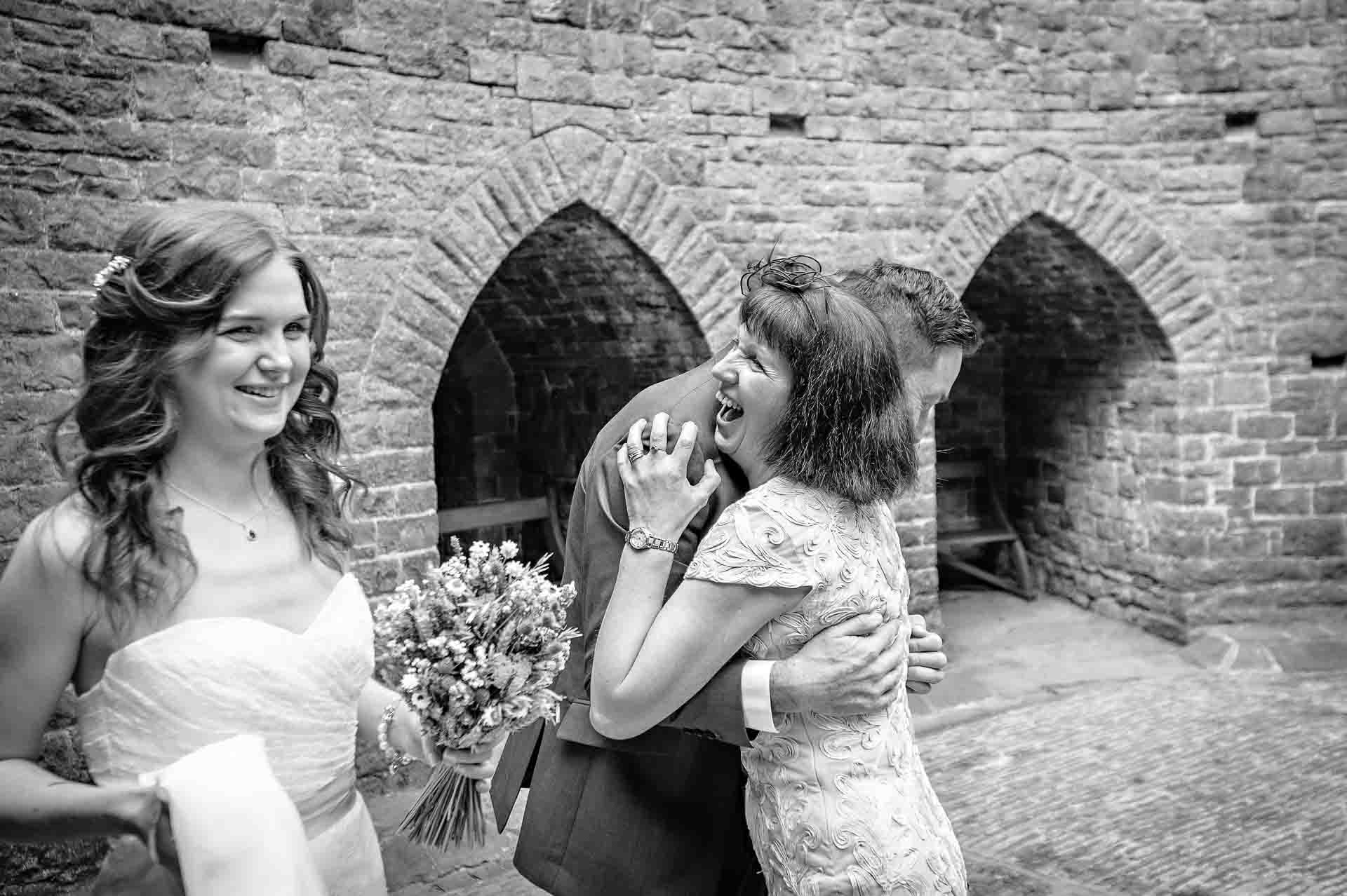 Congratulations Hug for Groom in Castell Coch Courtyard