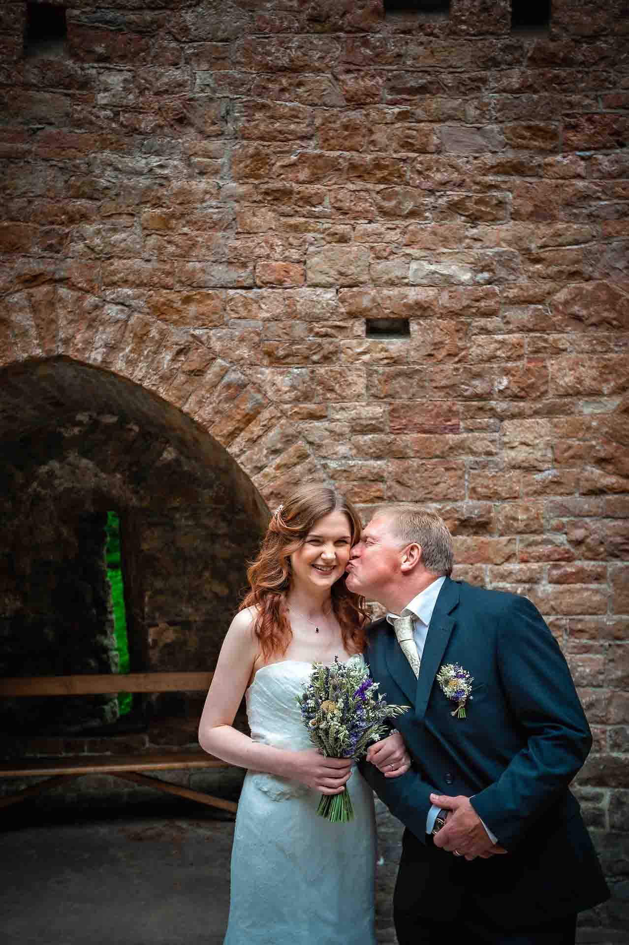 Father Give Bride a Wedding Kiss on Cheek