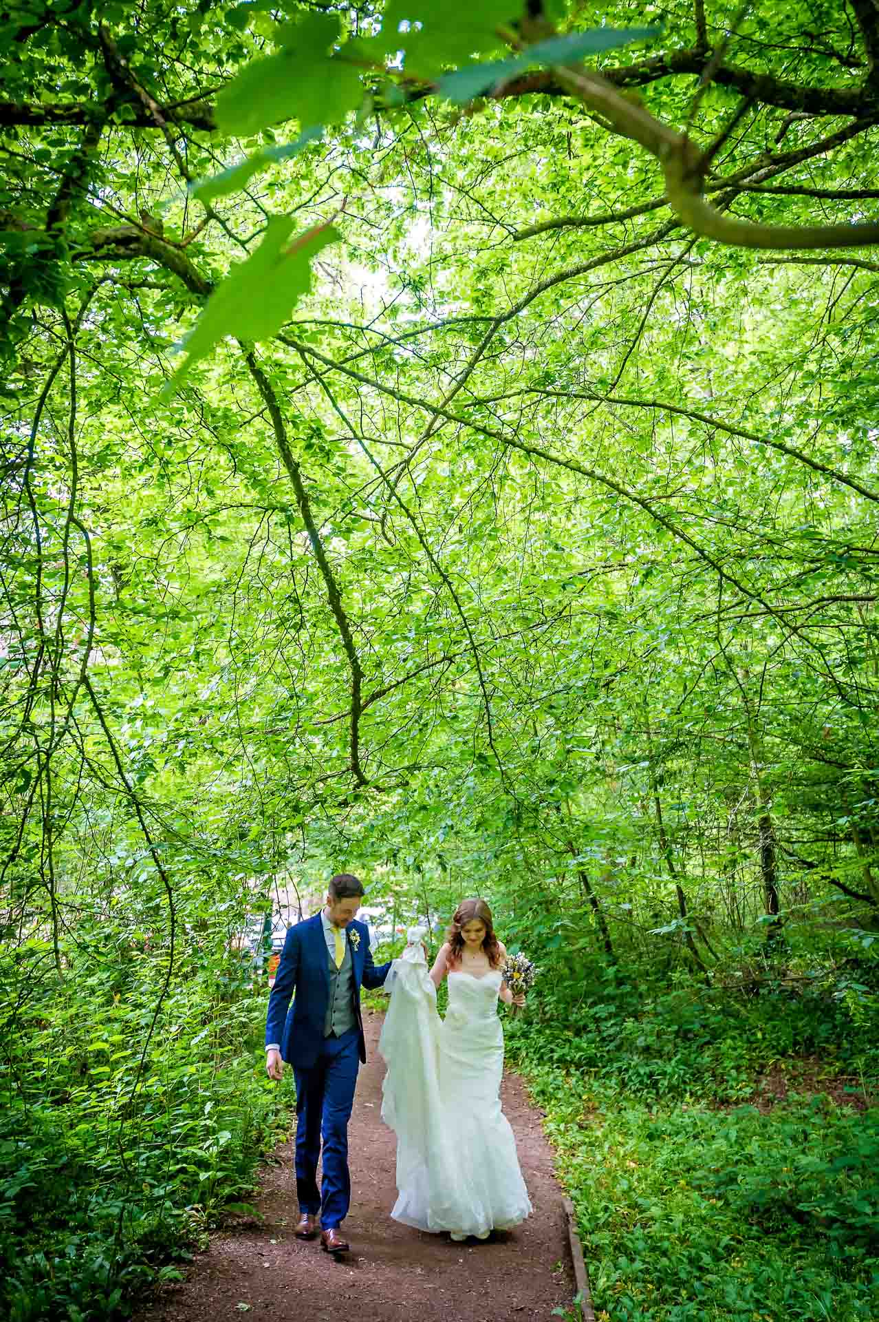 Wedding Portrait of Couple Walking in Fforest Fawr