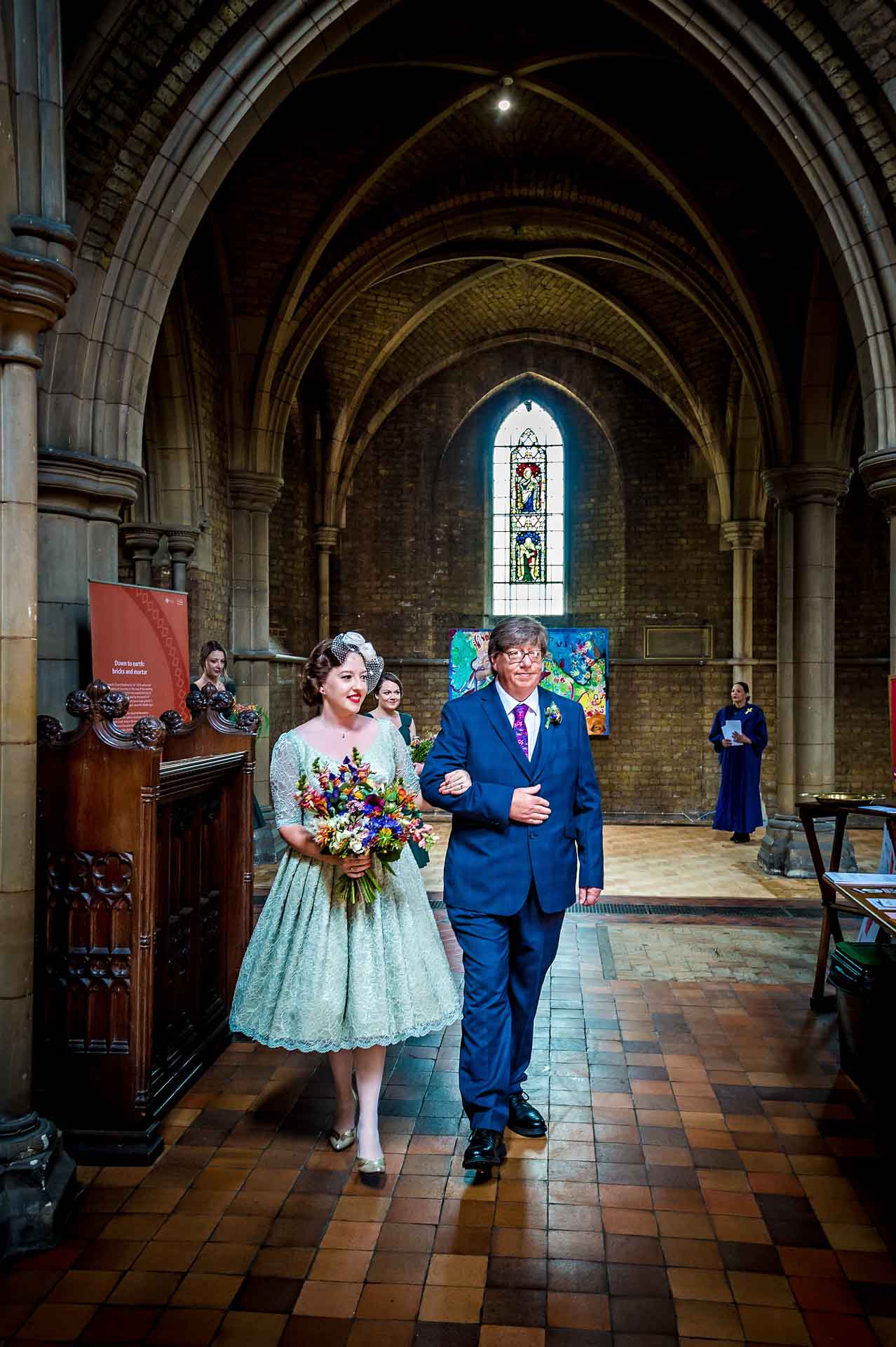 Bride and father entering church for wedding
