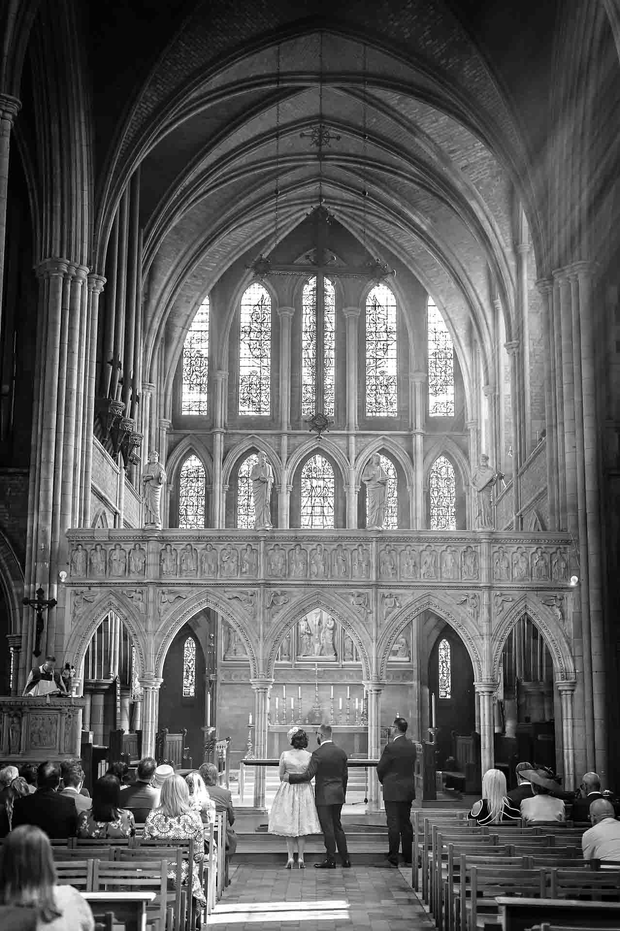 Church wedding ceremony from back with full height and architecture