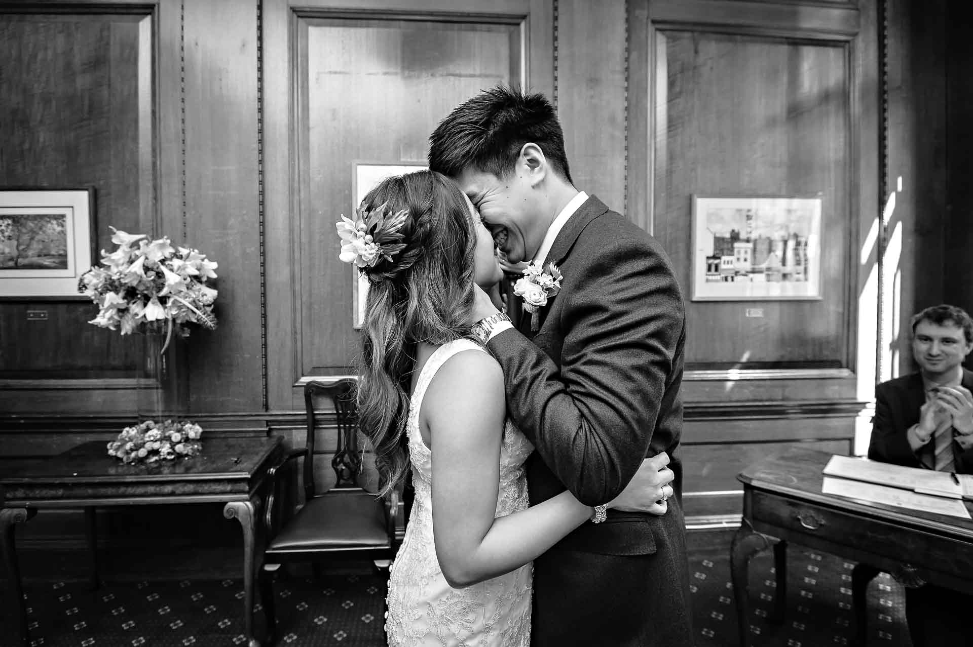 Couple holding each other after first kiss at Camden Town Hall