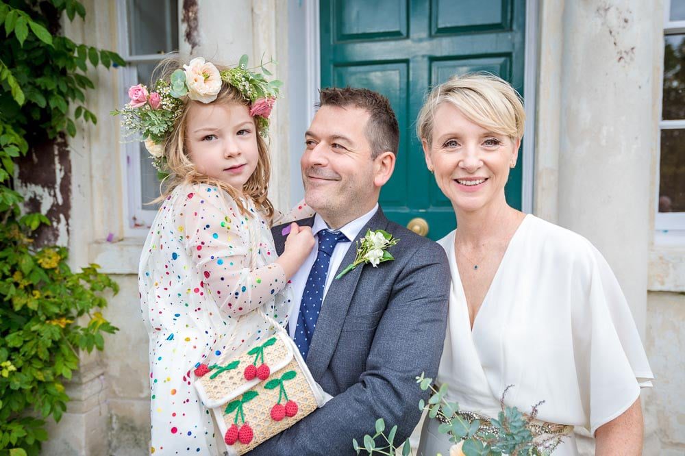 The newly-weds with daughter outside Morden Park House