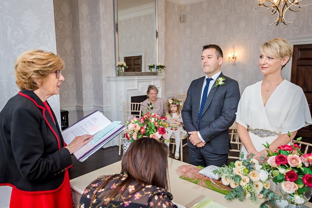 Registrar reading the vows at a wedding in Merton, South London