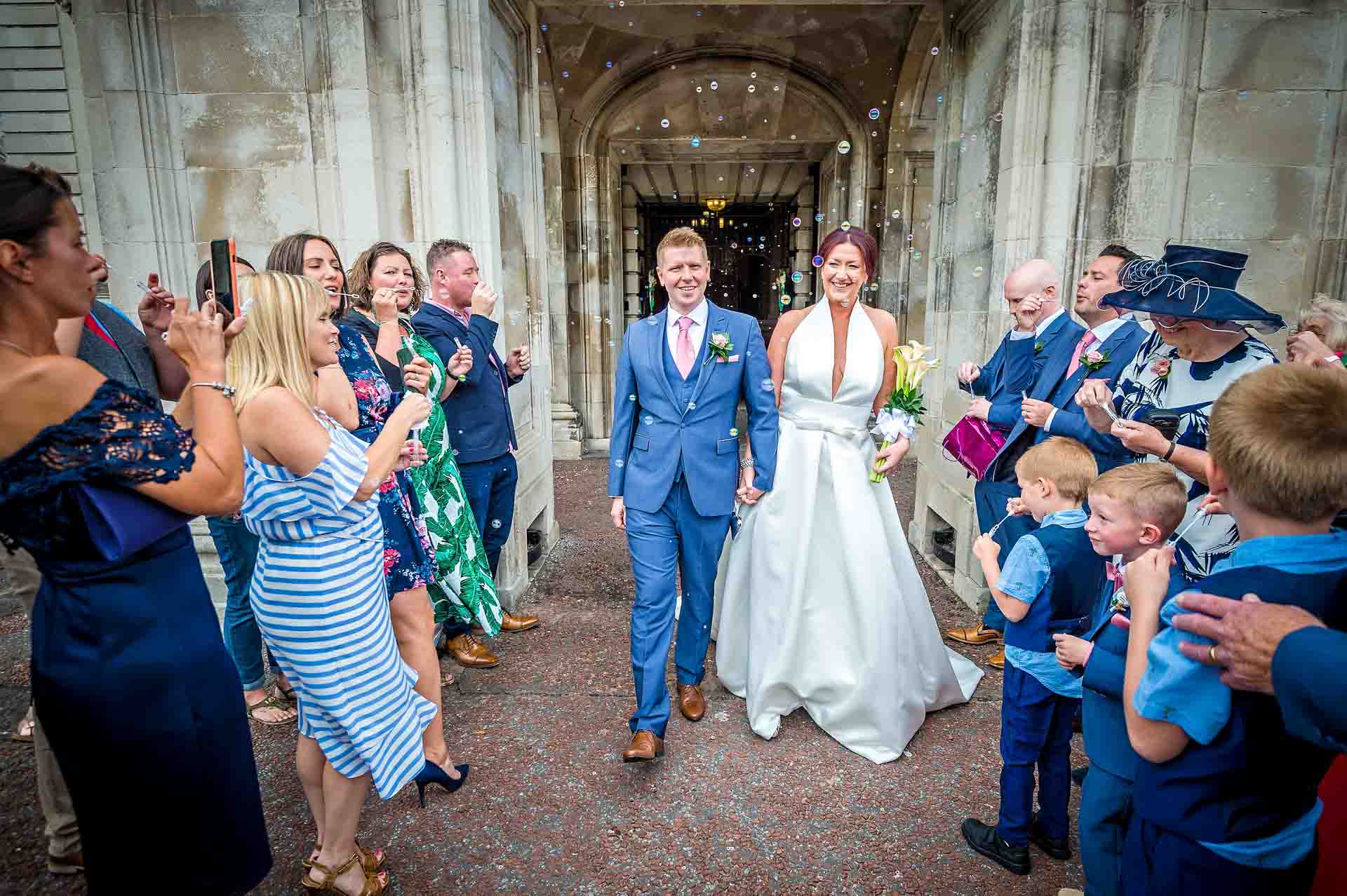 Wedding Bubbles Being Blown at Couple Exiting Cardiff City Hall