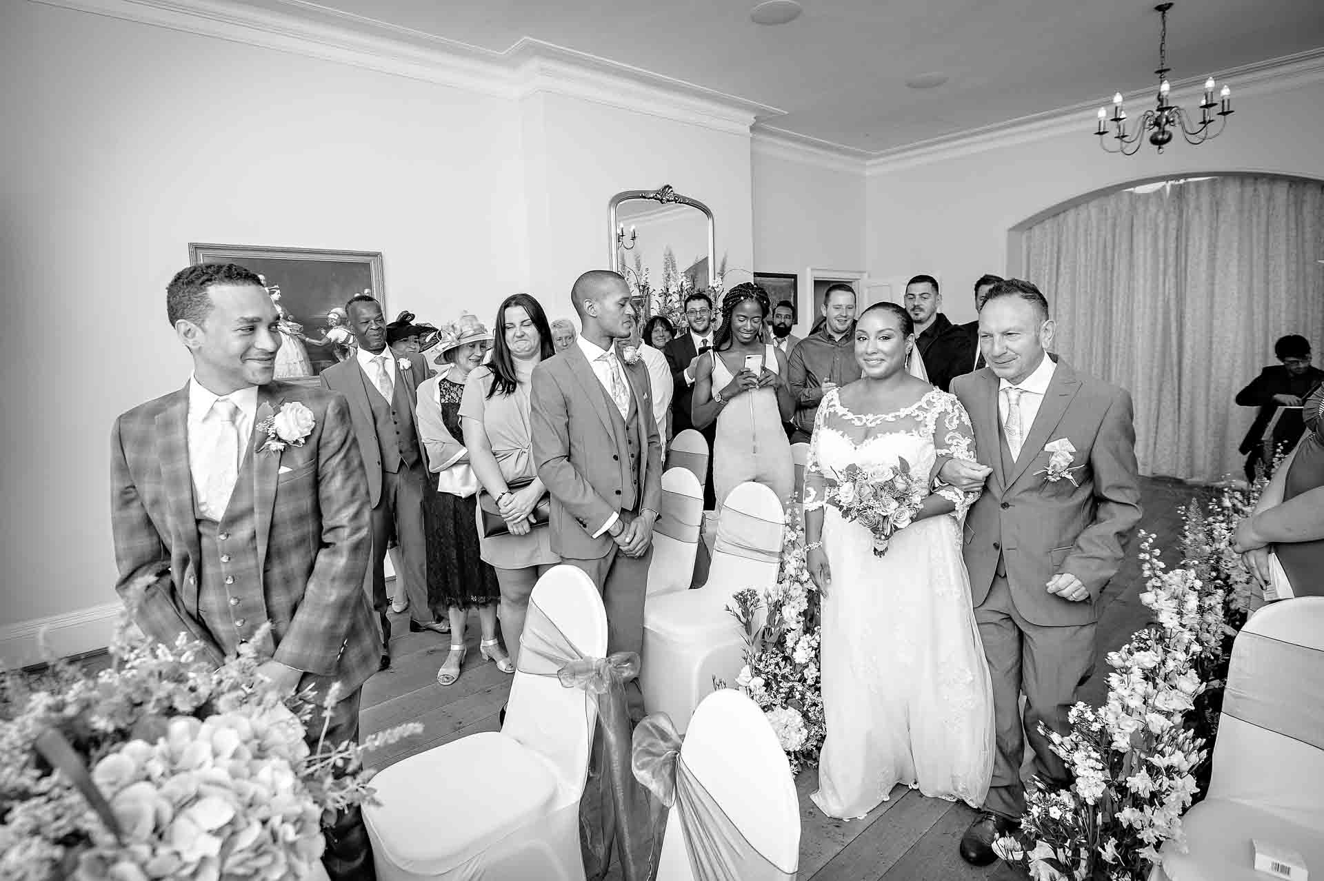 Groom sees bride for the first time at Pembroke Lodge wedding