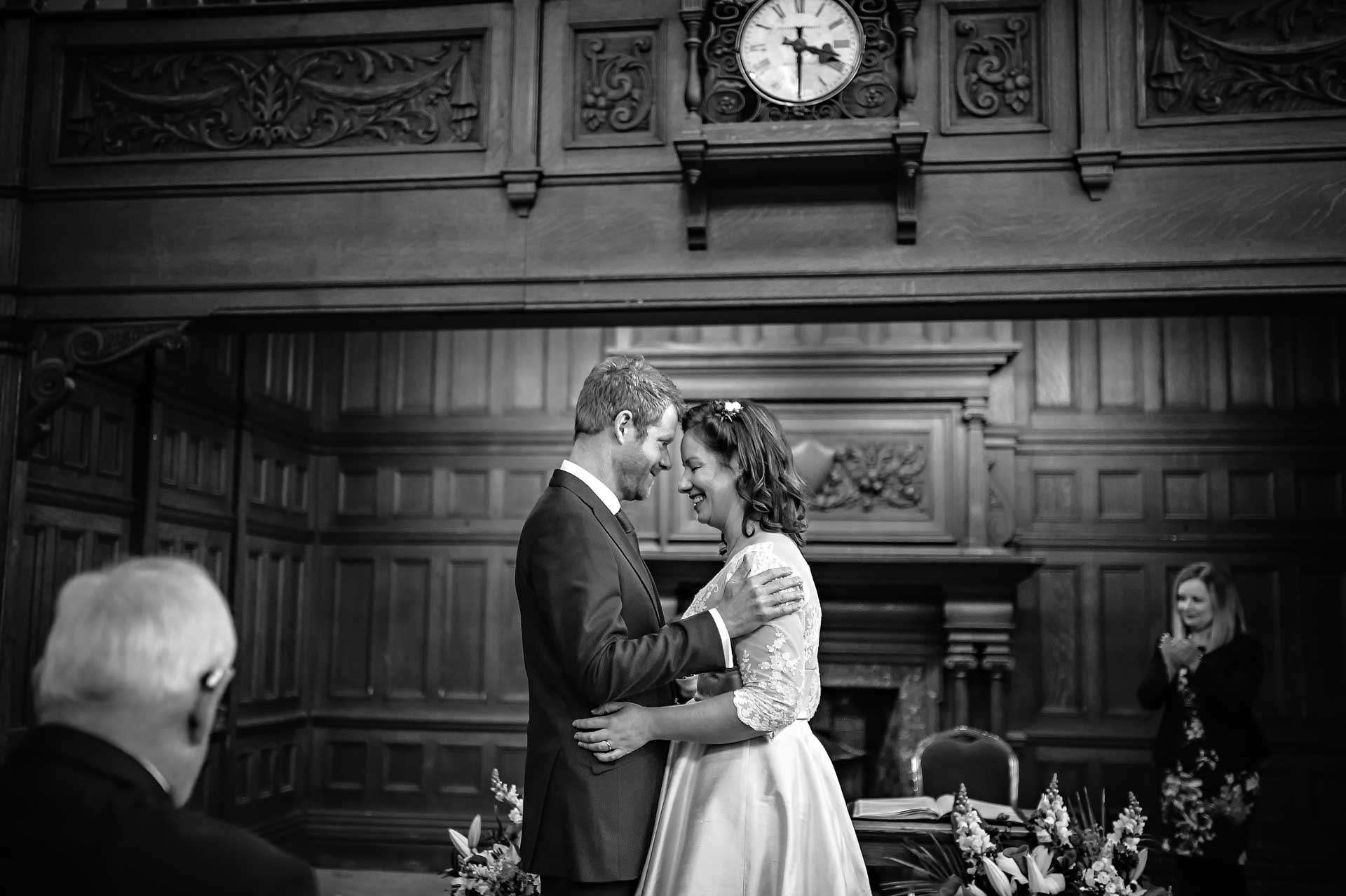 Groom Holding Bride During Wedding Ceremony at Chiswick Town Hall