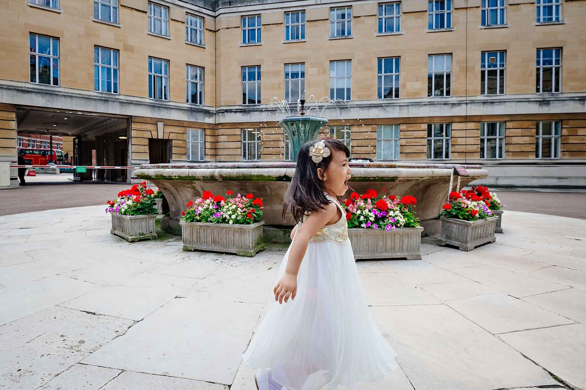 Wandsworth Town Hall Wedding Photographer - Girl Running in Courtyard