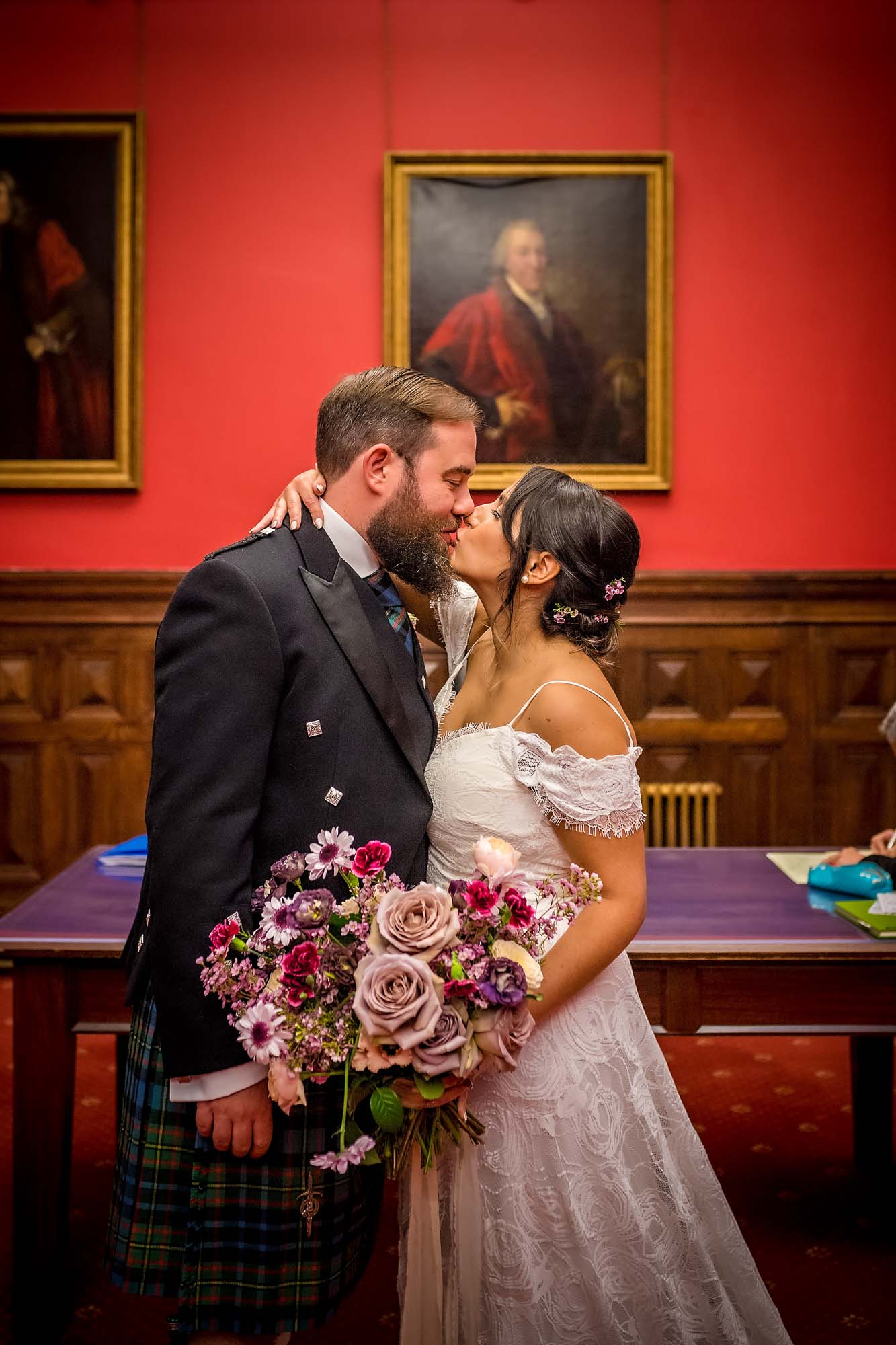 The couple kiss in portrait taken in the Mayoral Room, Bristol