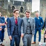 Gay Couple at Caerpgilly Castle Wedding Getting Showered in Confetti