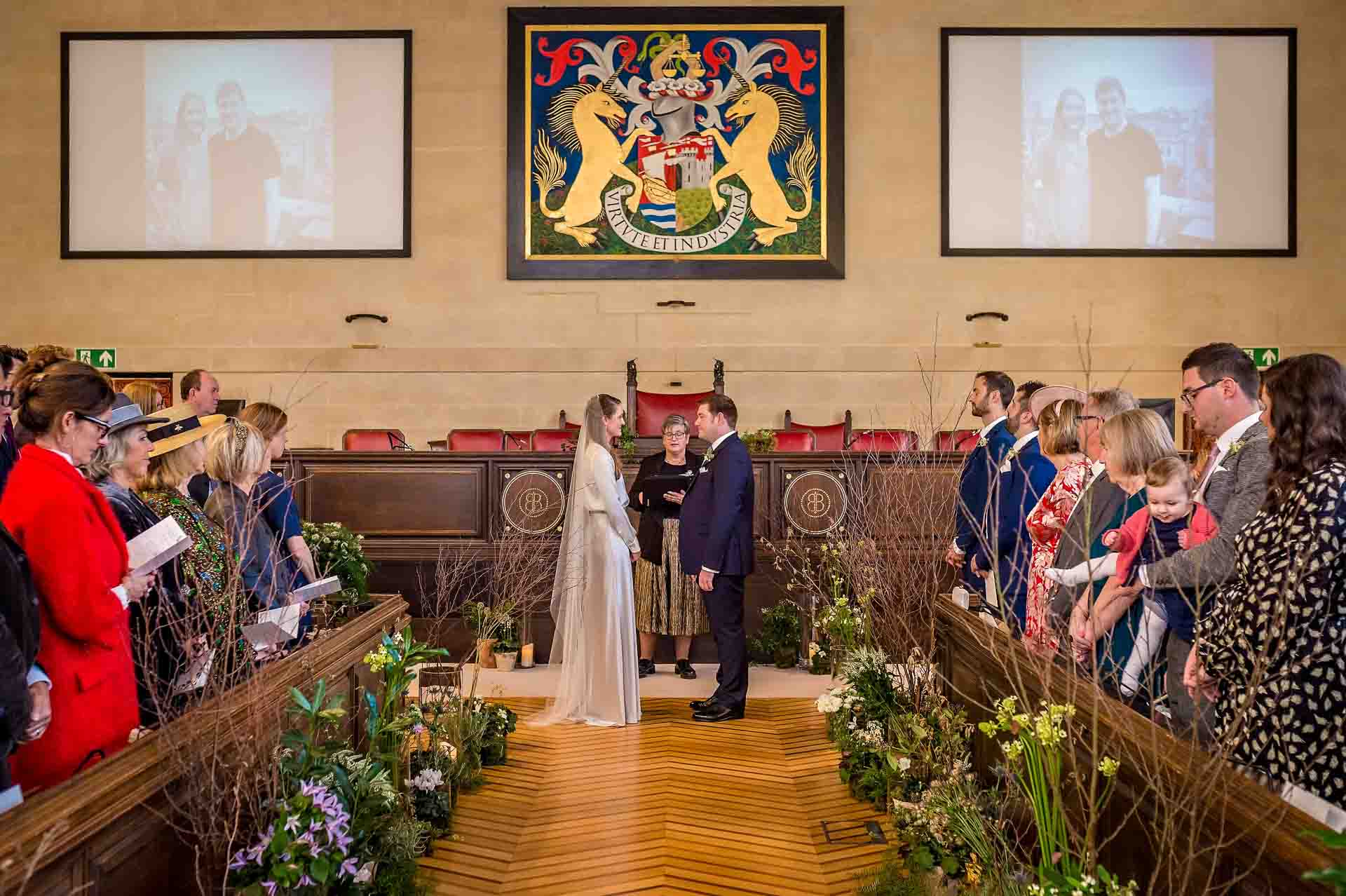 Photo of marriage ceremony taken from back of Council Chamber at Bristol City Hall