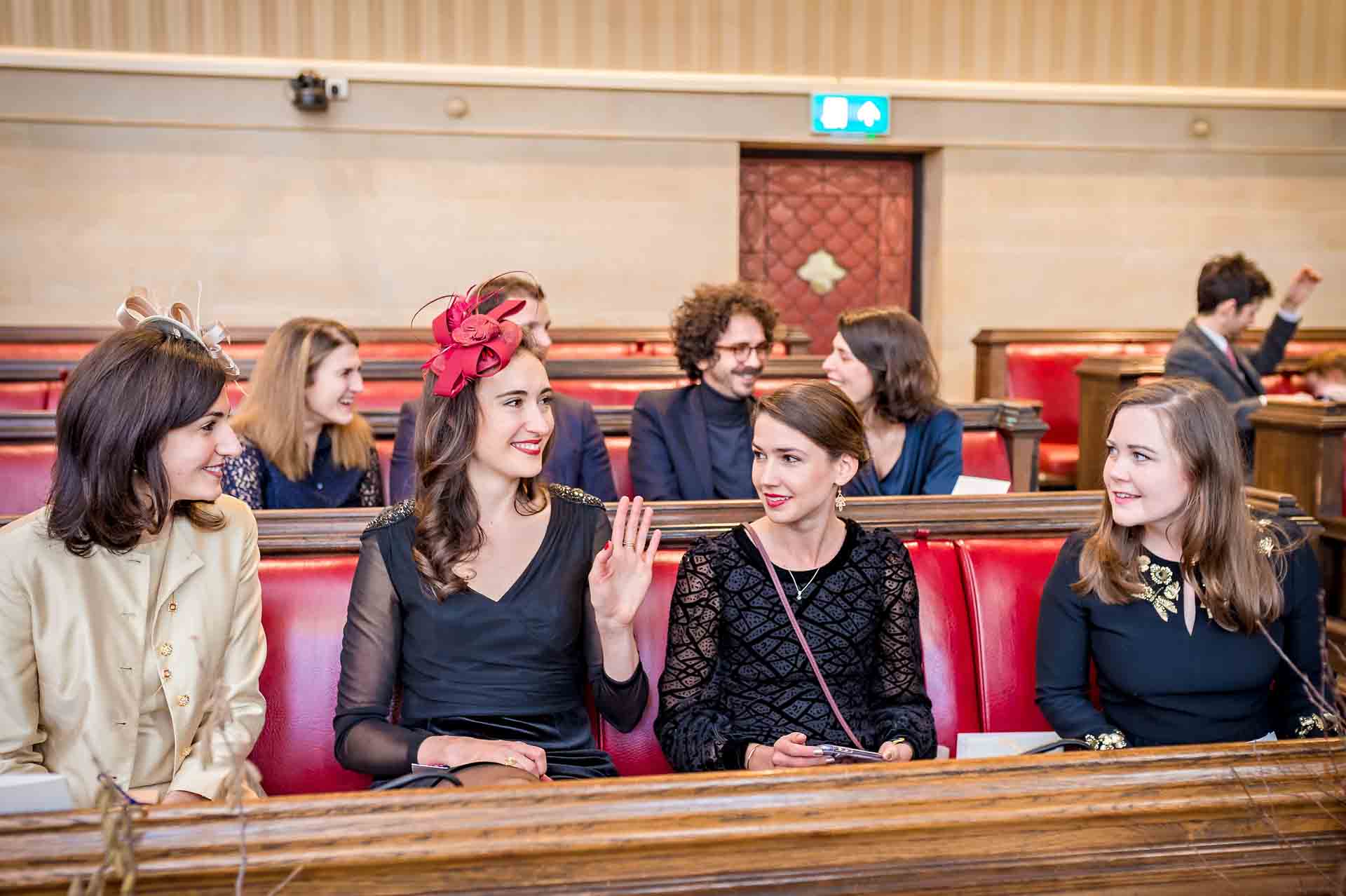 Four female guests seated on benches in Council Chamber at Bristol City Hall