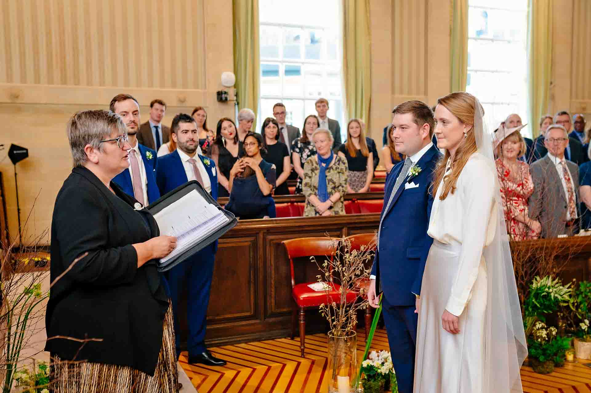 Registrar reads the vows to the couple at Bristol City Hall marriage ceremony