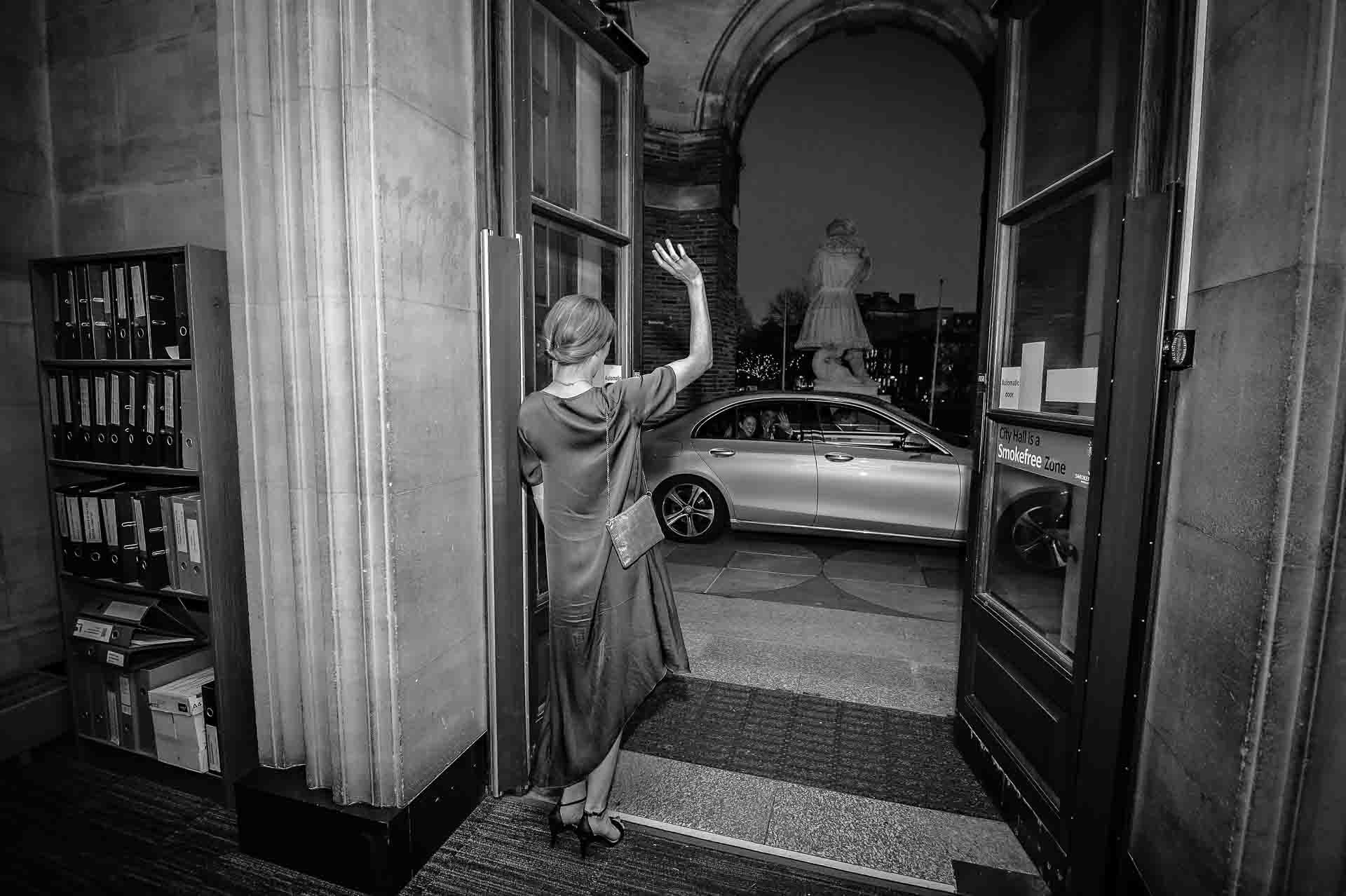 Guest waving couple off from the doorway at Bristol City Hall