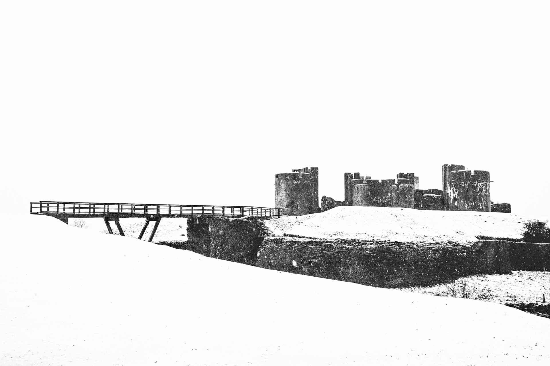 Distant Profile of Caerphilly Castle and Bridge in the Snow