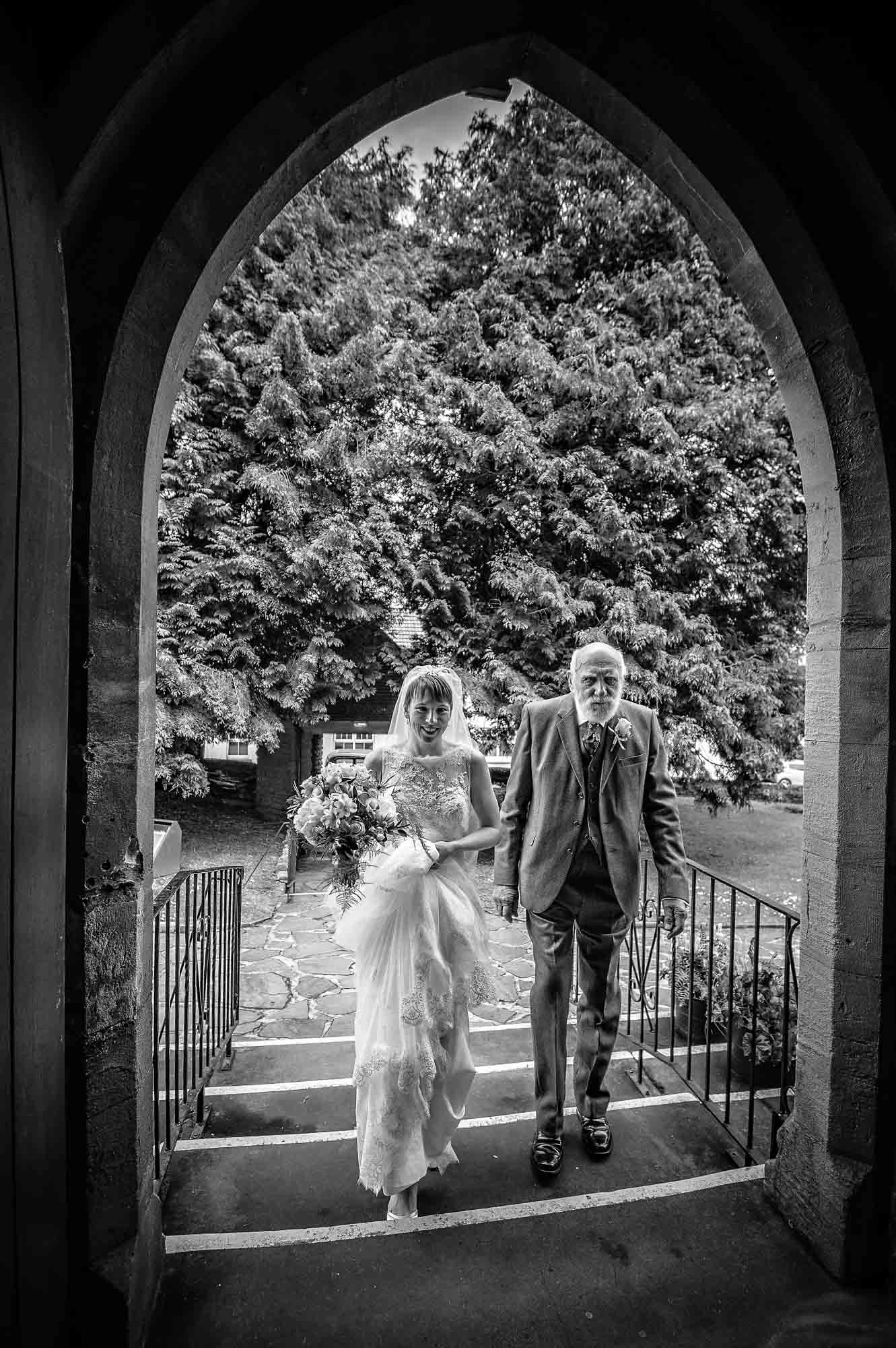 Bride and grandfather enter St Martin's Church in Caerphilly