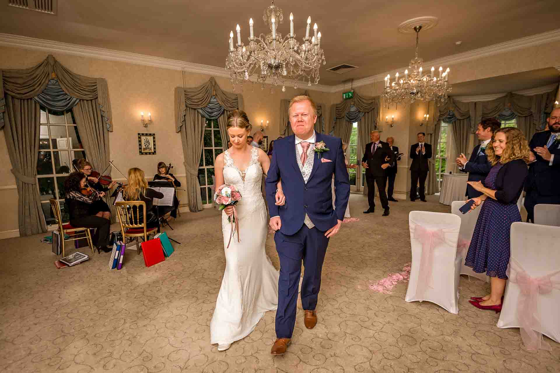 Bride and Groom Walking Back Down the Aisle After Wedding Ceremony