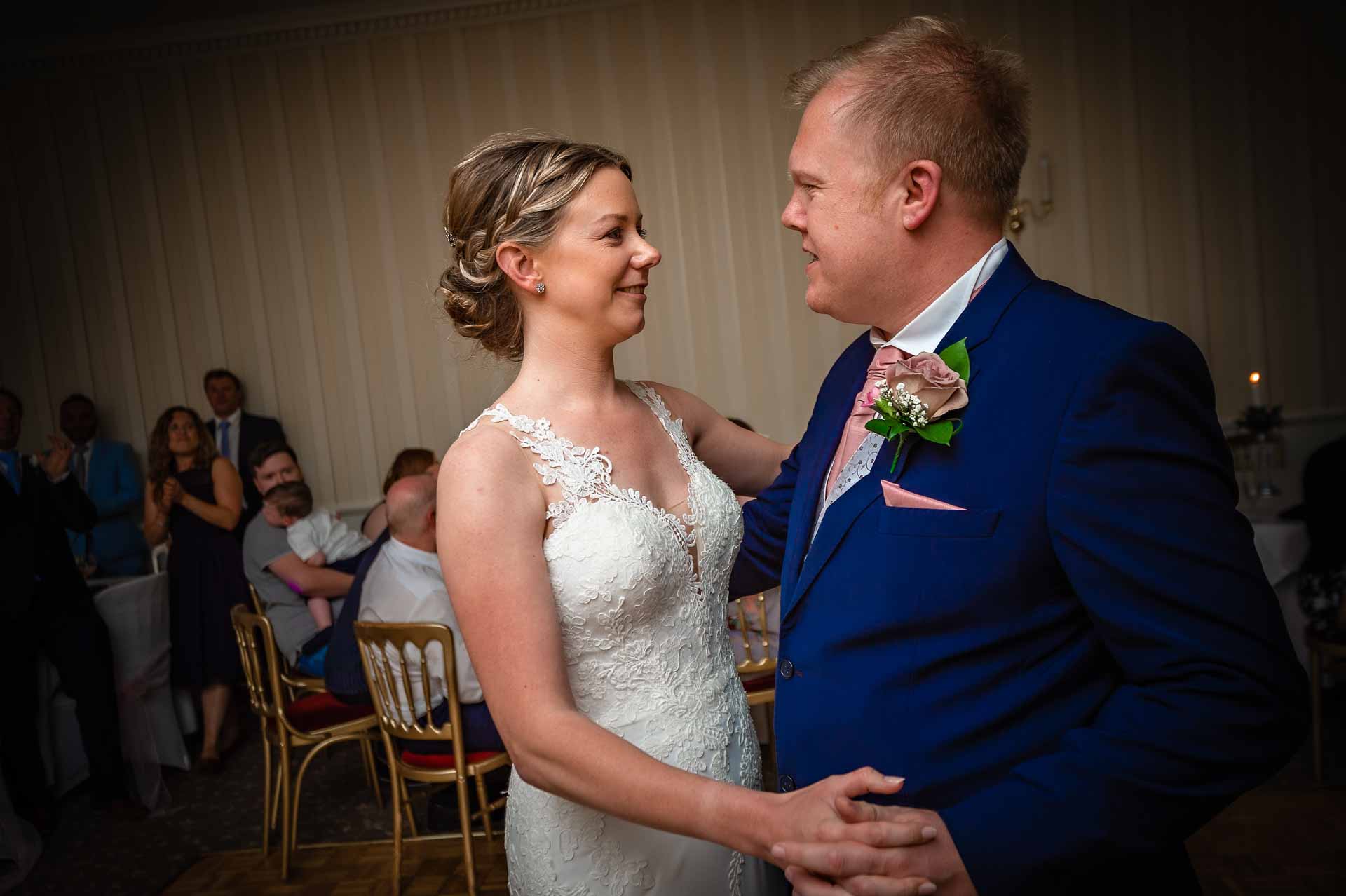 Couple take their first dance at wedding reception