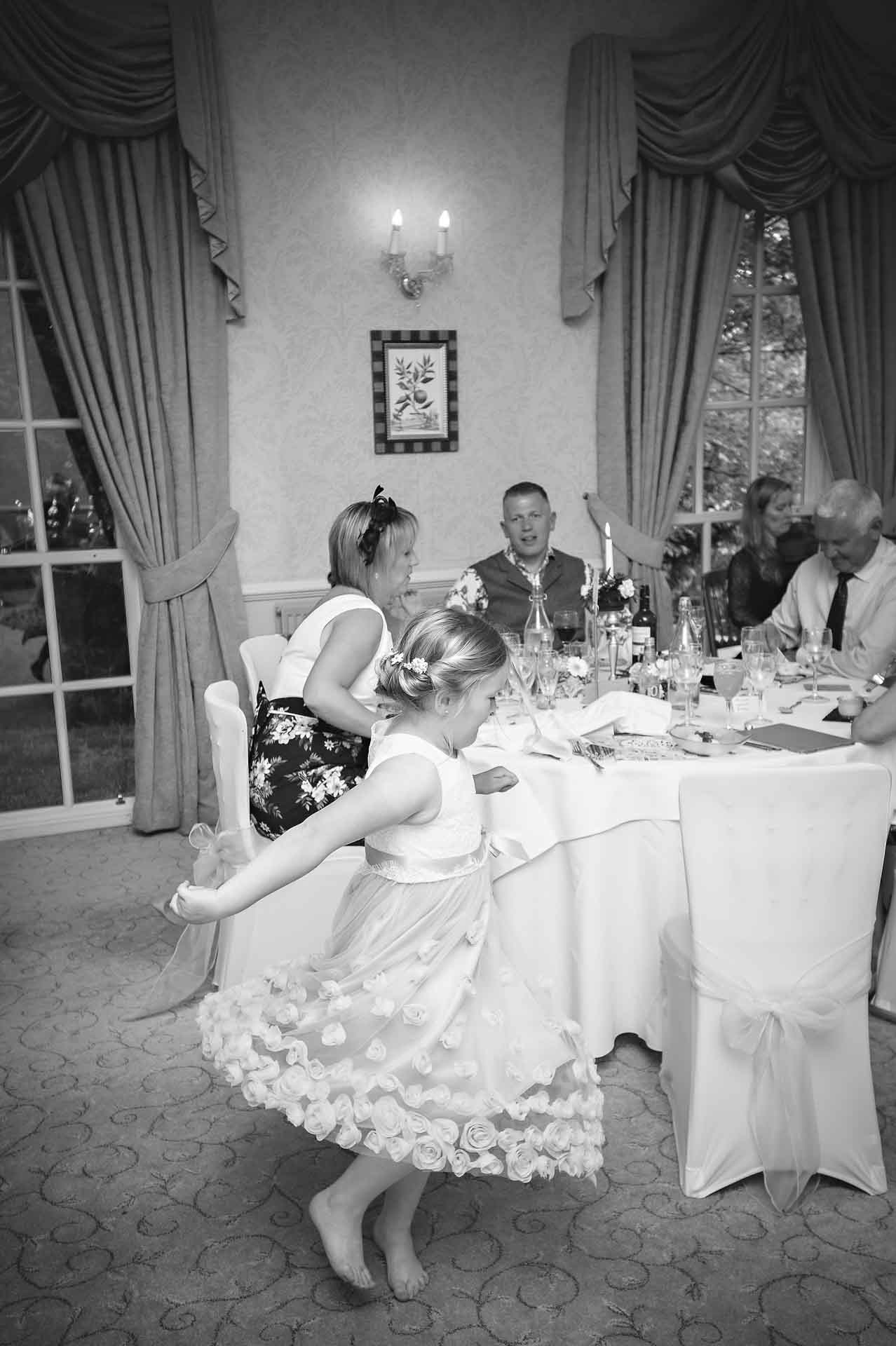 Bridesmaid dancing at wedding meal