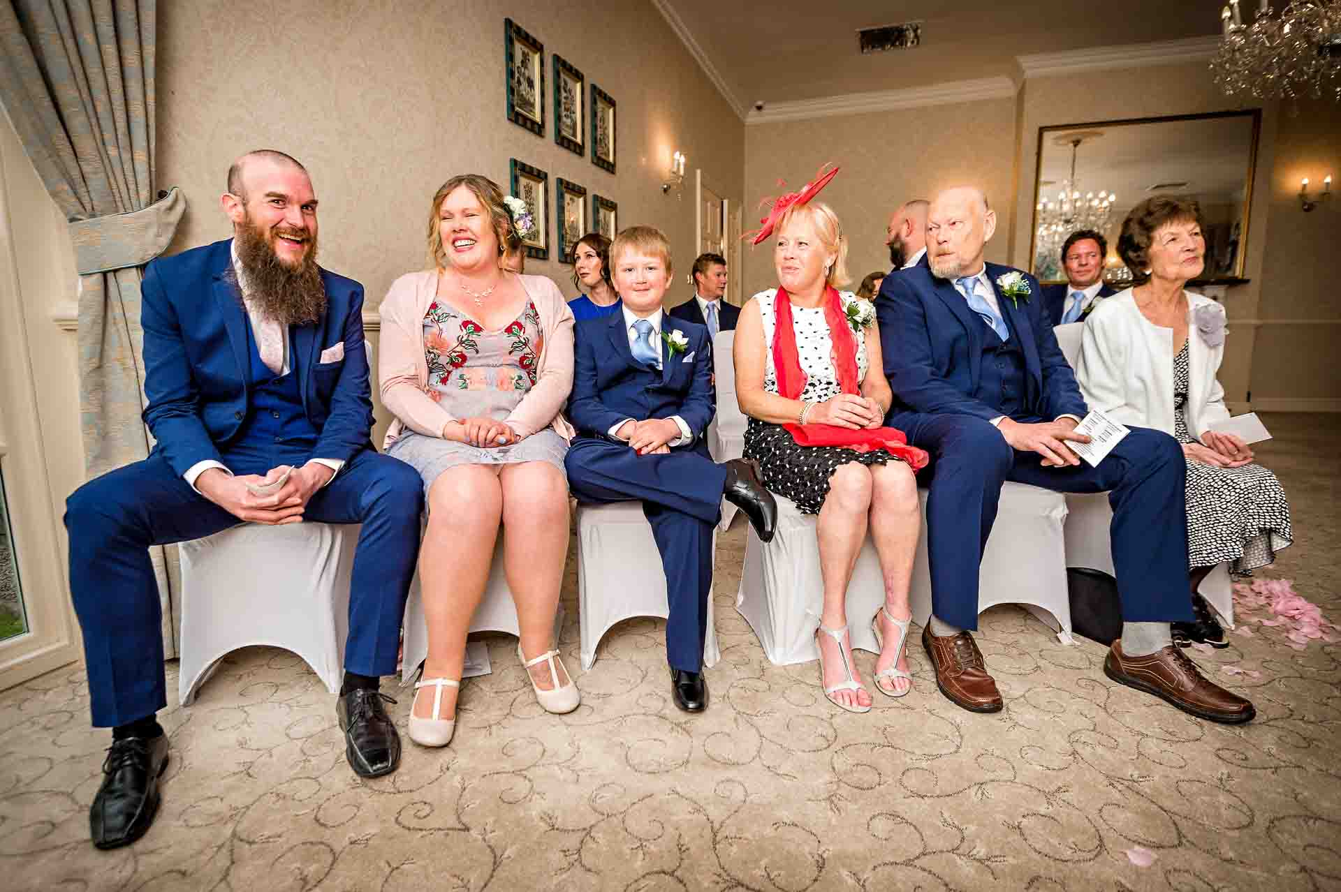 Wedding guests watching in front row of ceremony