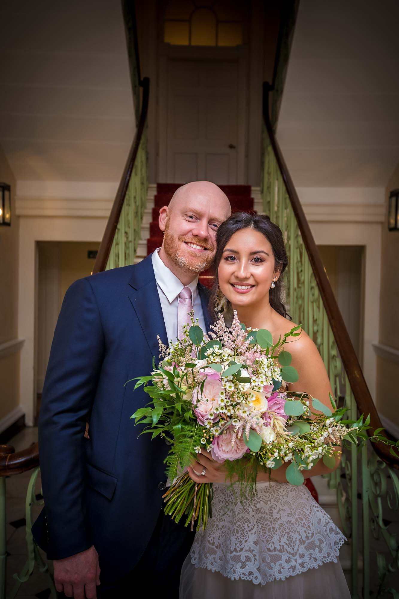 The married couple pose in the hallway of Morden Park House/Merton Register Office