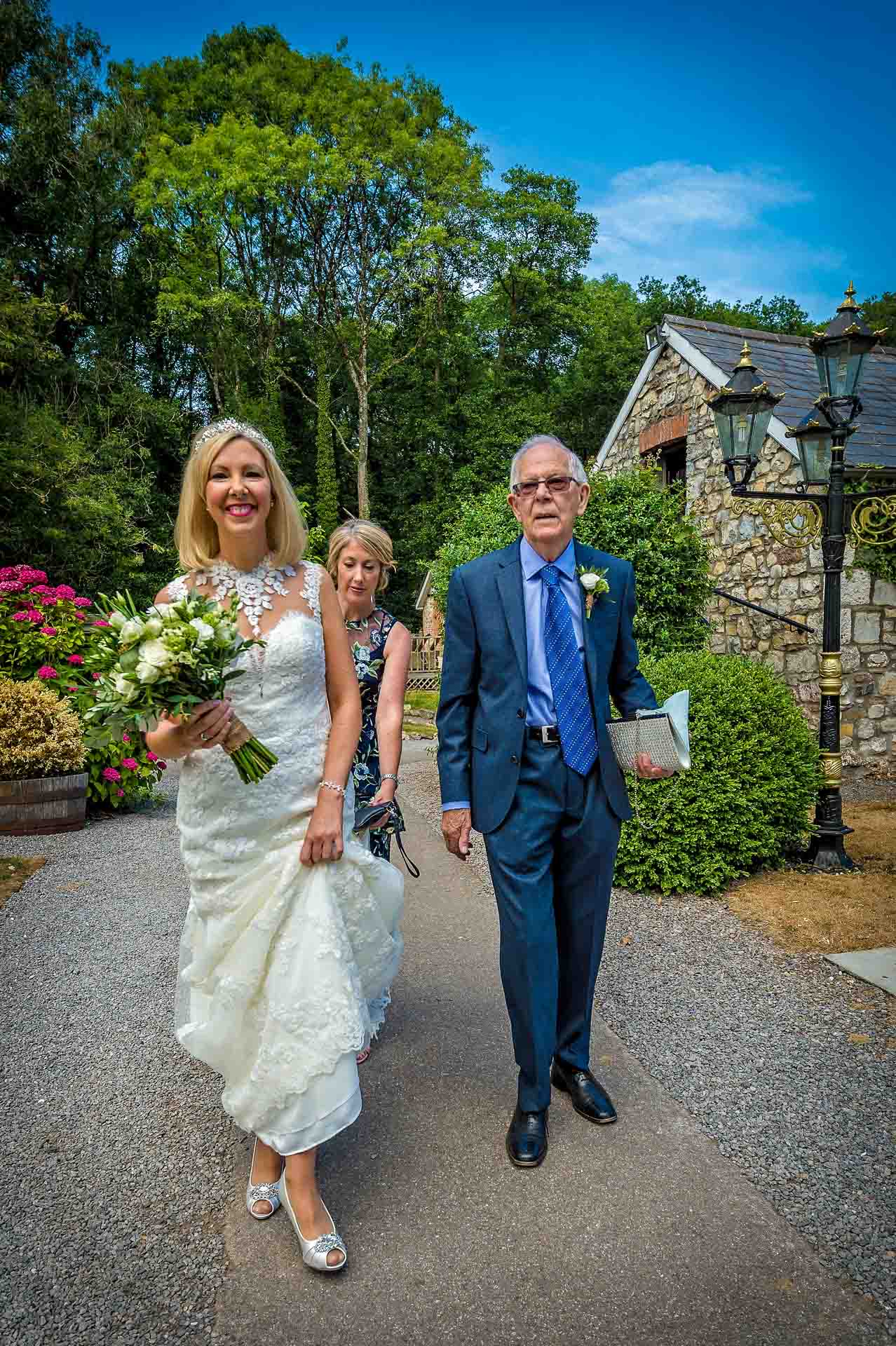 Bride with Father Walk to the Wedding Ceremony at Pencoed House