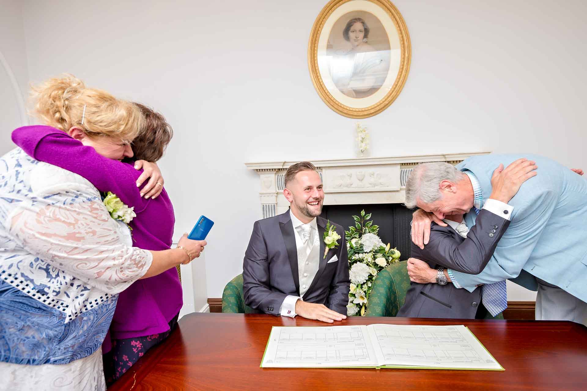 Couple being congratulated by parents at register office wedding in Bromley