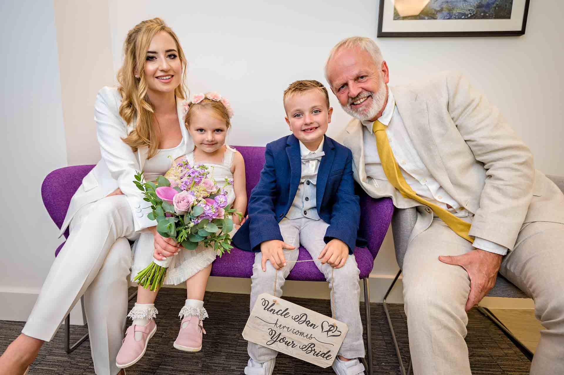 Bride with children and father at wedding in the Chelsea Old Town Hall, London