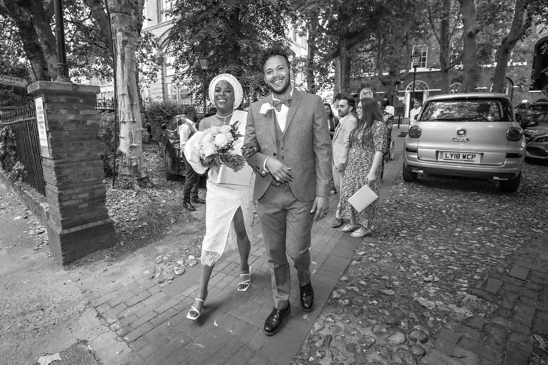 The smiling newlyweds depart Southwark Regsiter Office after their wedding ceremony