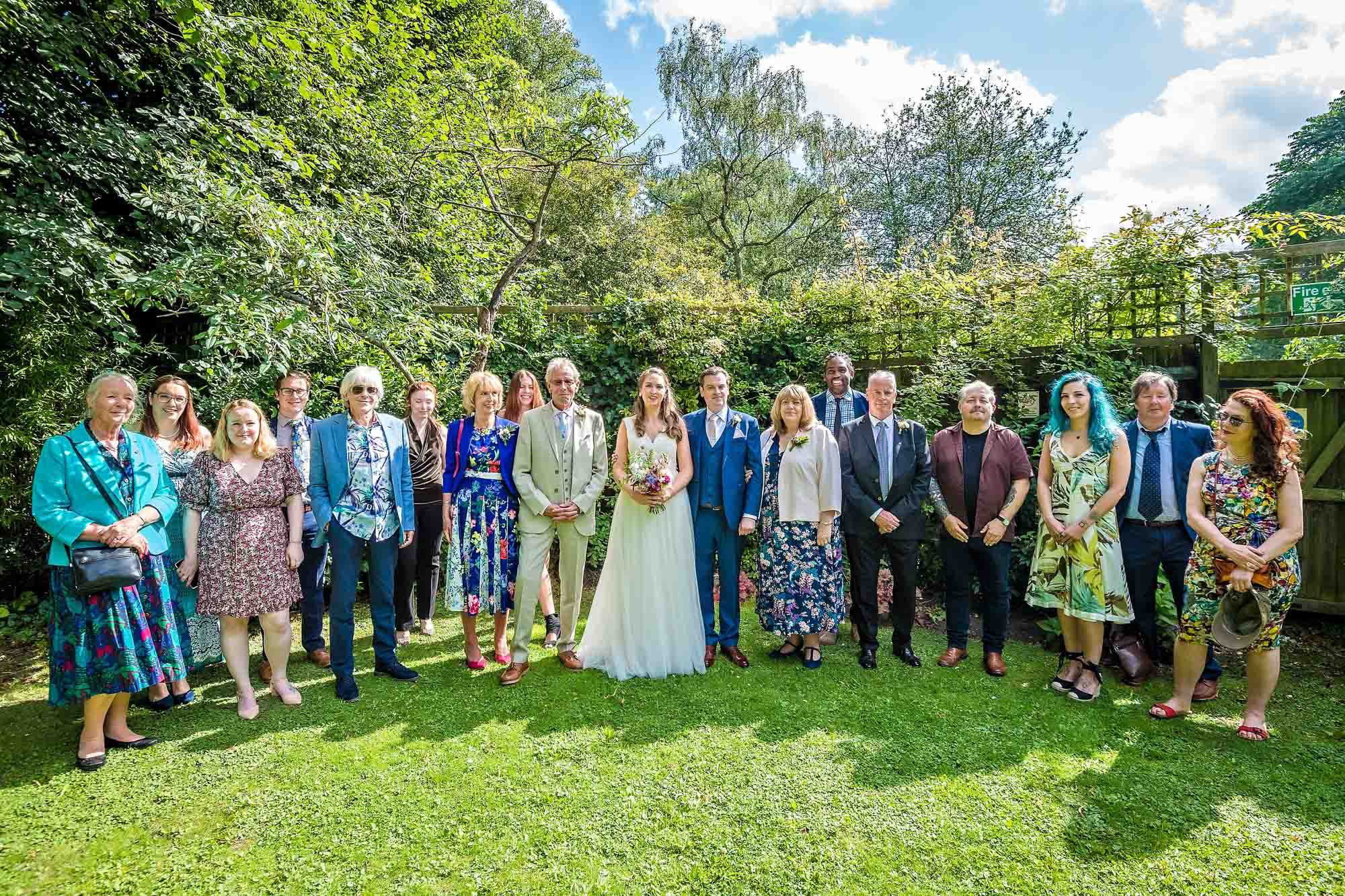 The wedding party pose in the garden at Southwark Register Office