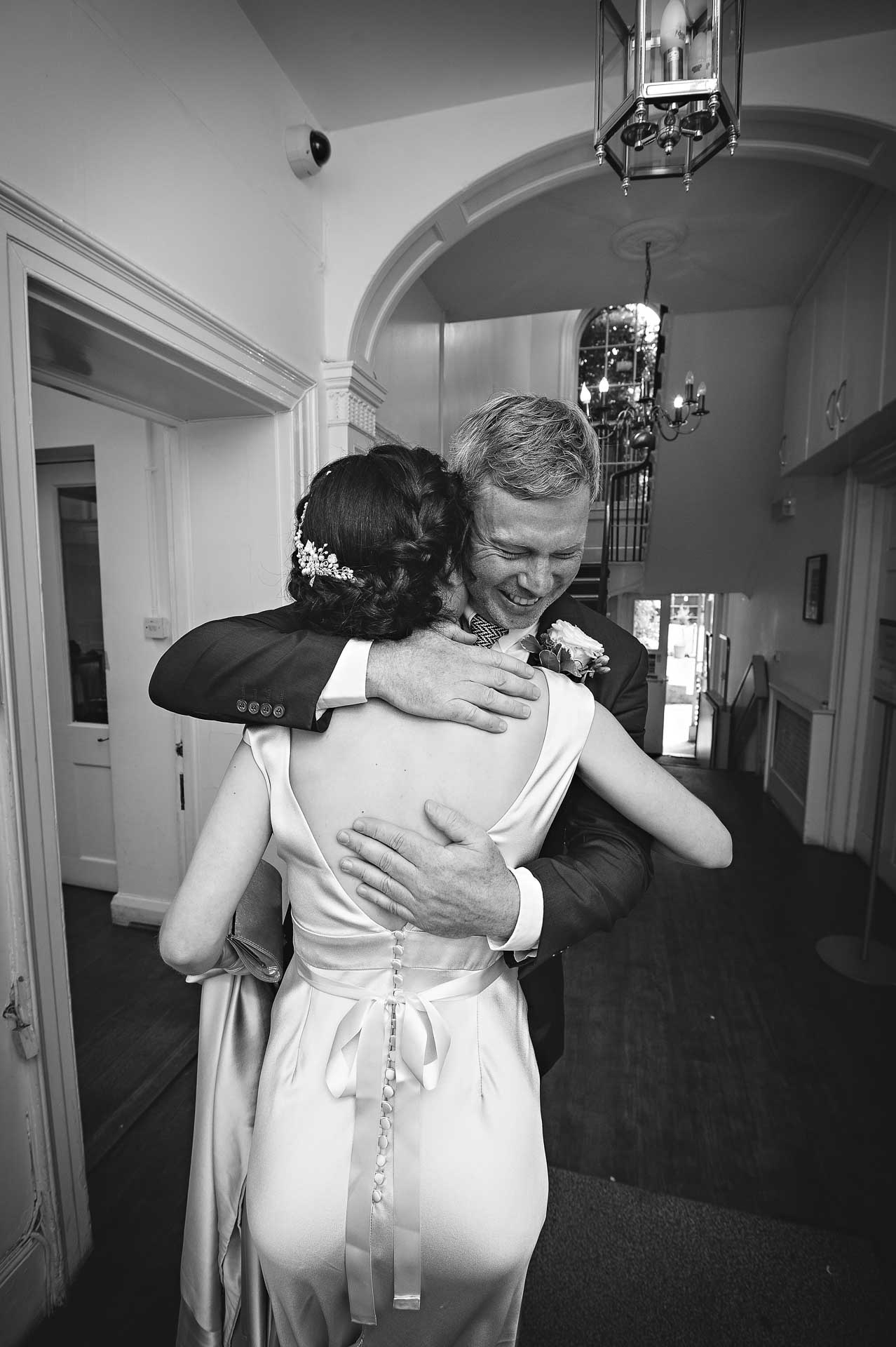 The couple greet each other before their wedding at Southwark Register Office