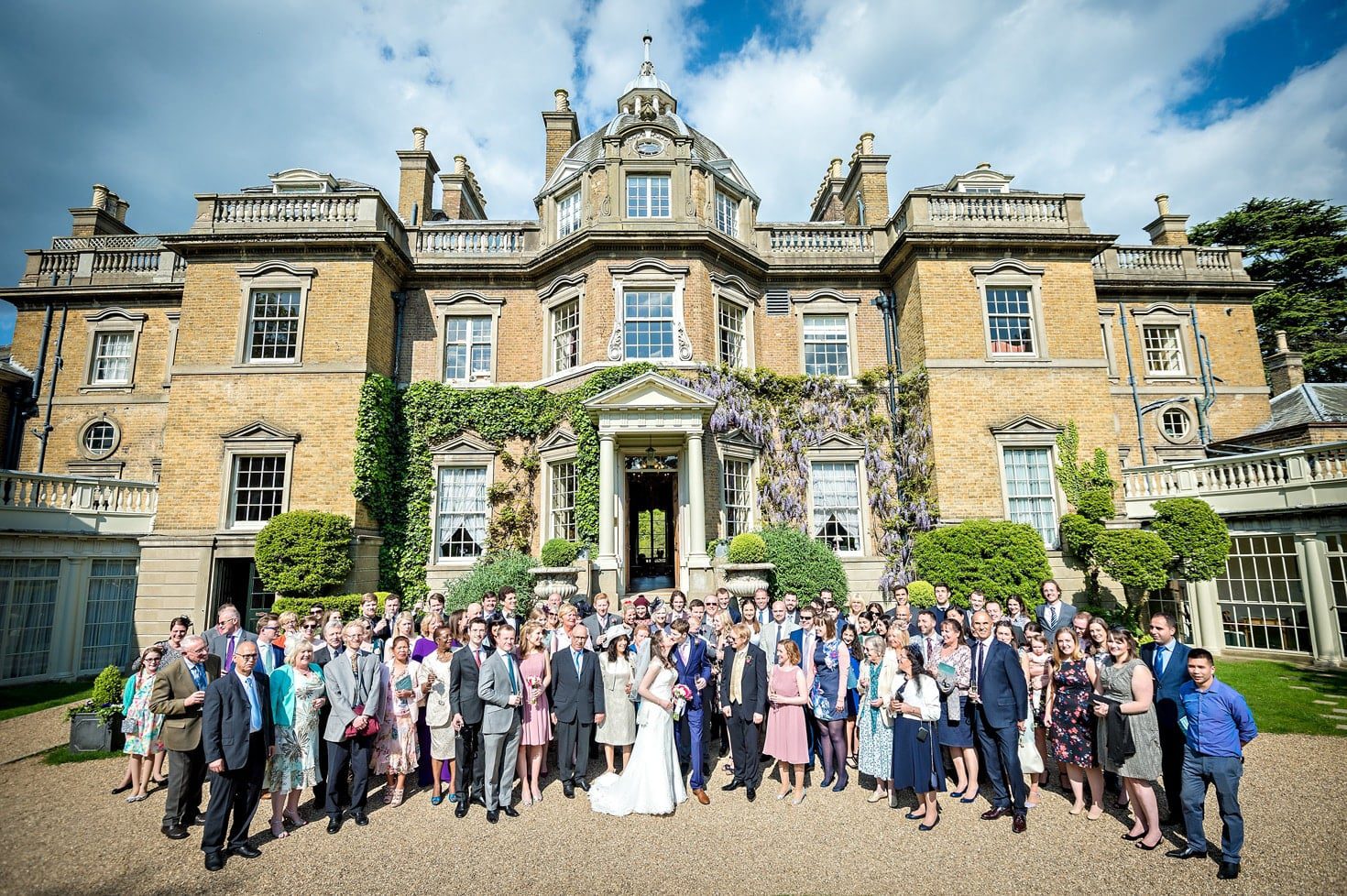 Hampton Court House Wedding Photography - Group Photo Outside with House in Background